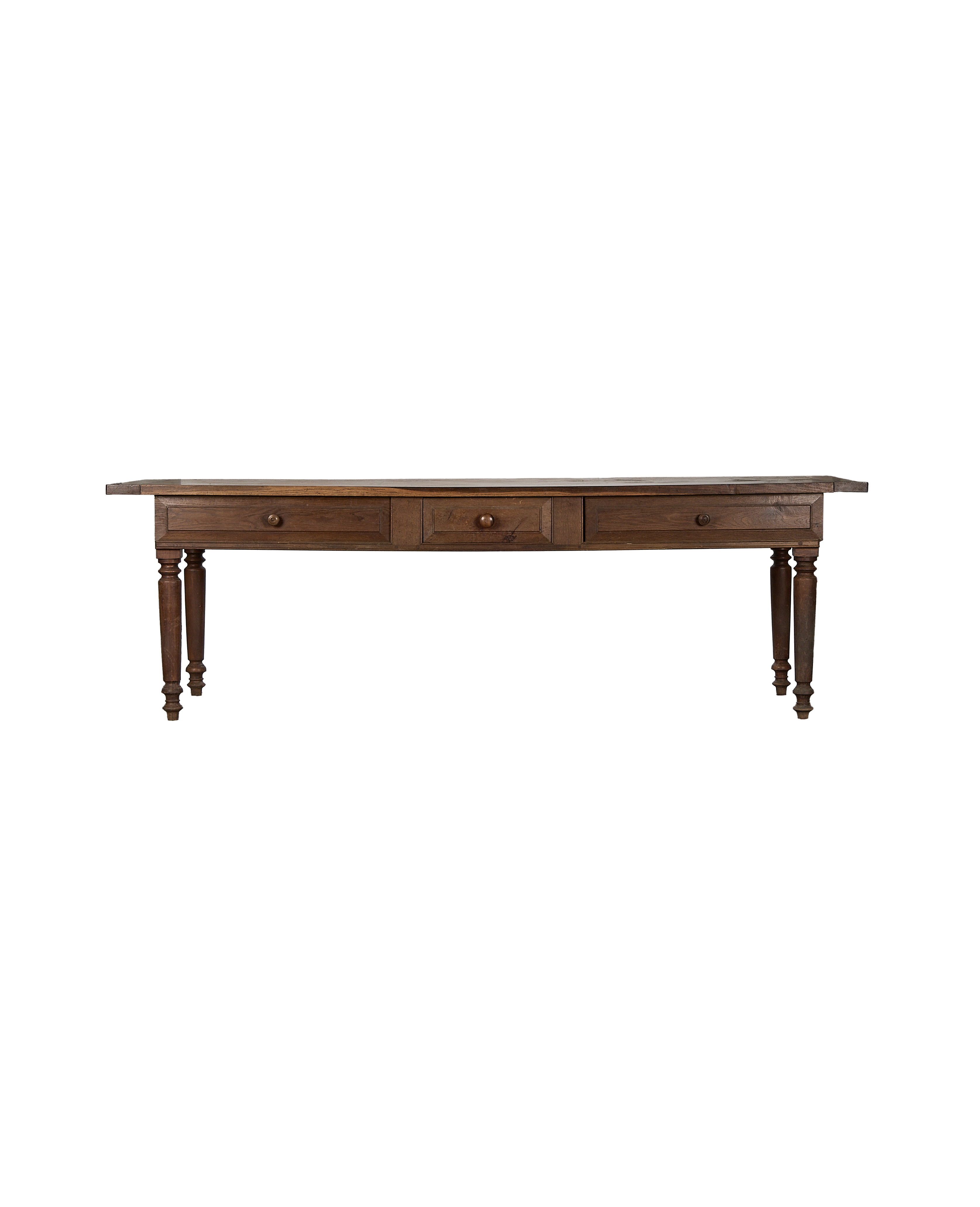 Front view of vintage French oak draper's table with three small drawers.