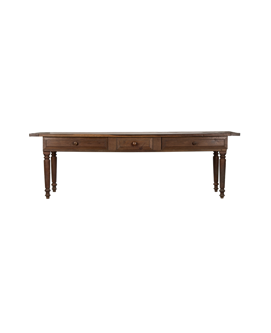 Front view of vintage French oak draper's table with three small drawers.