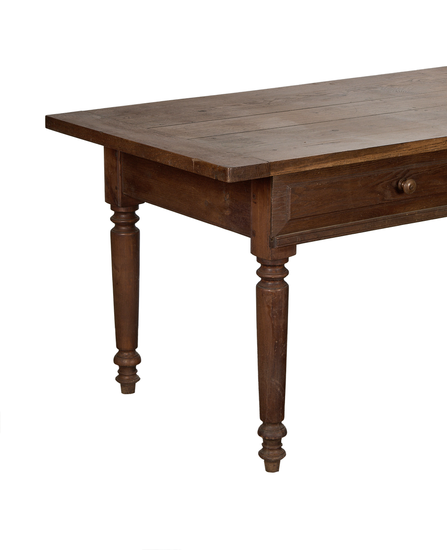 Vintage French oak draper's table, close-up view showing the drawer and turned leg.