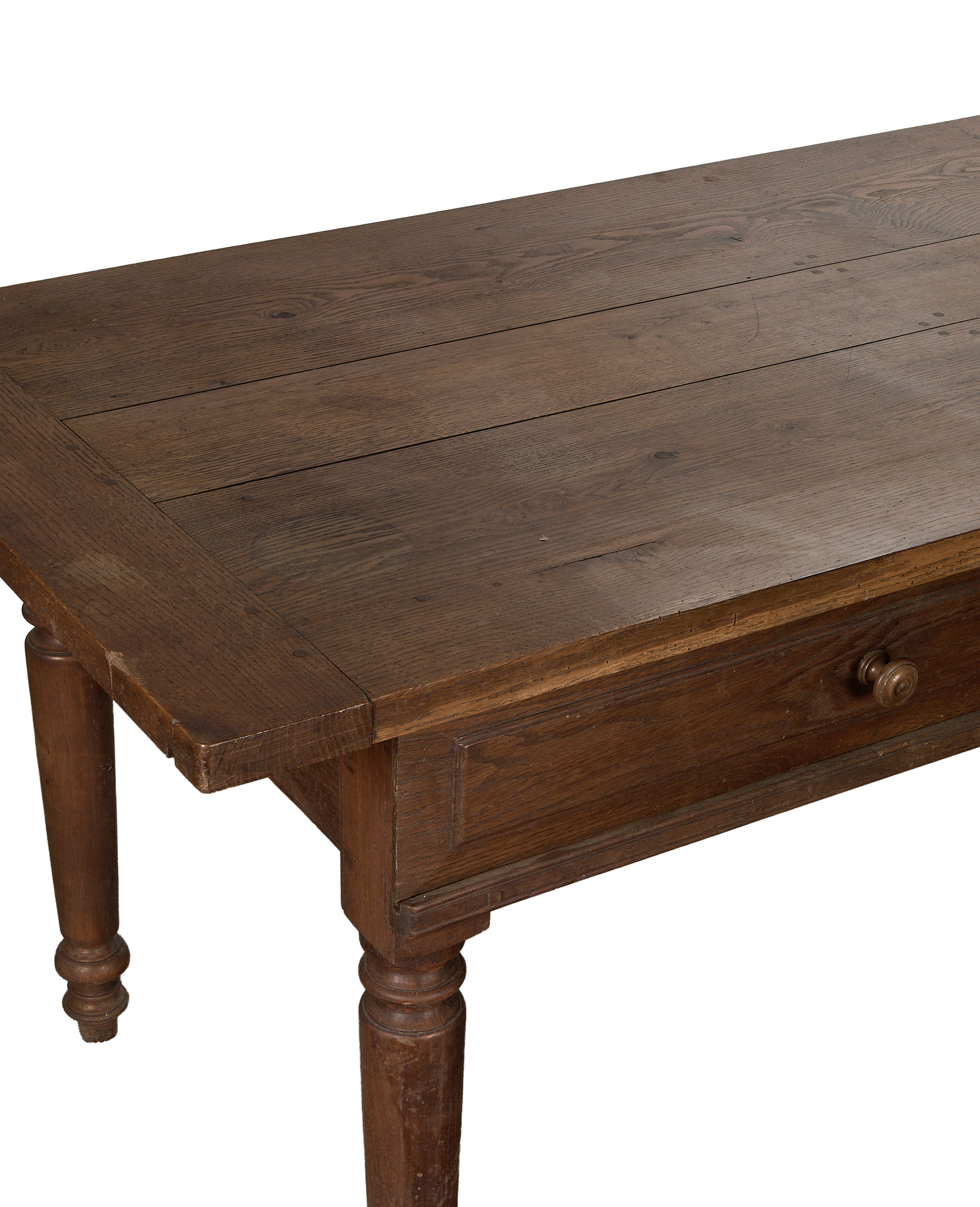 Vintage French oak draper's table showing plank top, drawer details, and turned legs.