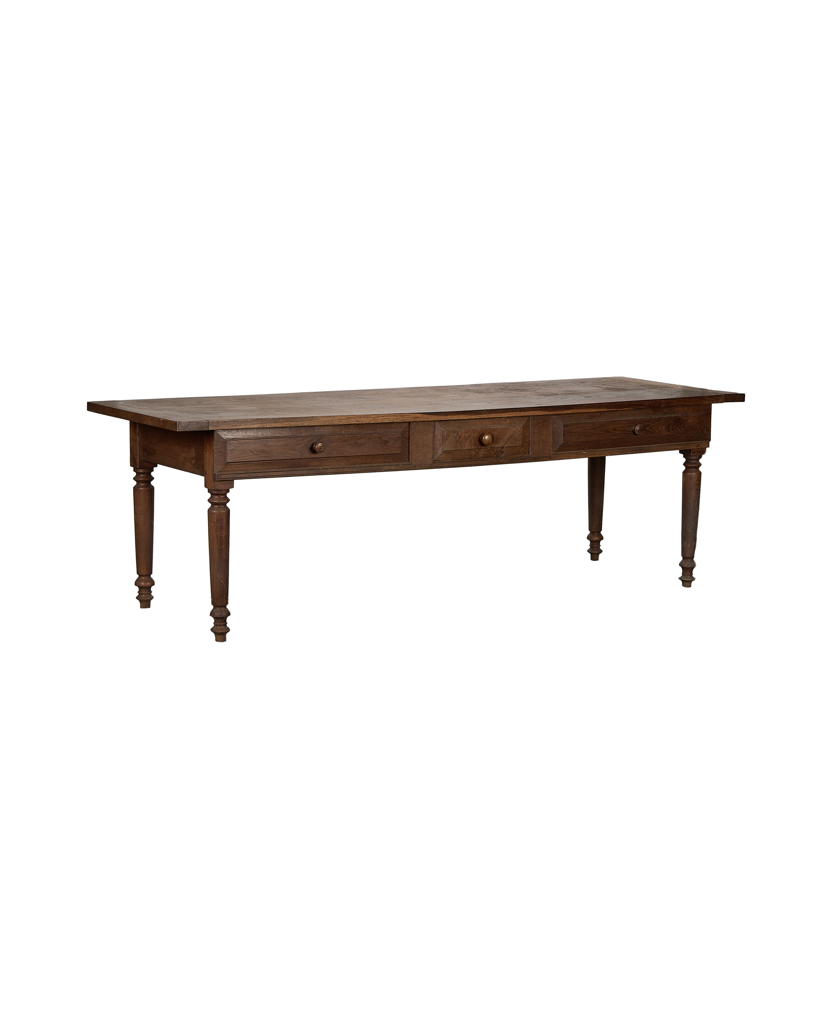Vintage French oak draper's table, three drawers, turned legs, warm brown distressed finish.