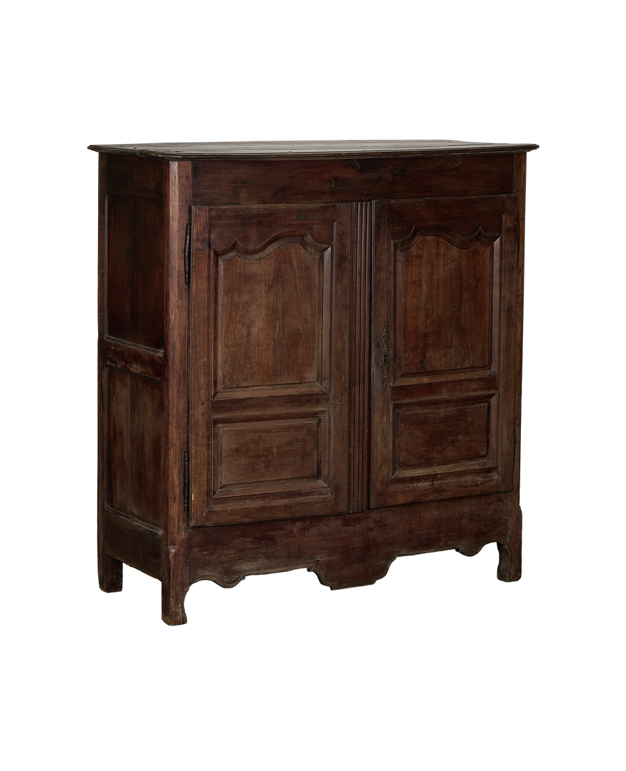 Vintage French oak armoire, detailed view of paneled doors, aged dark wood finish.