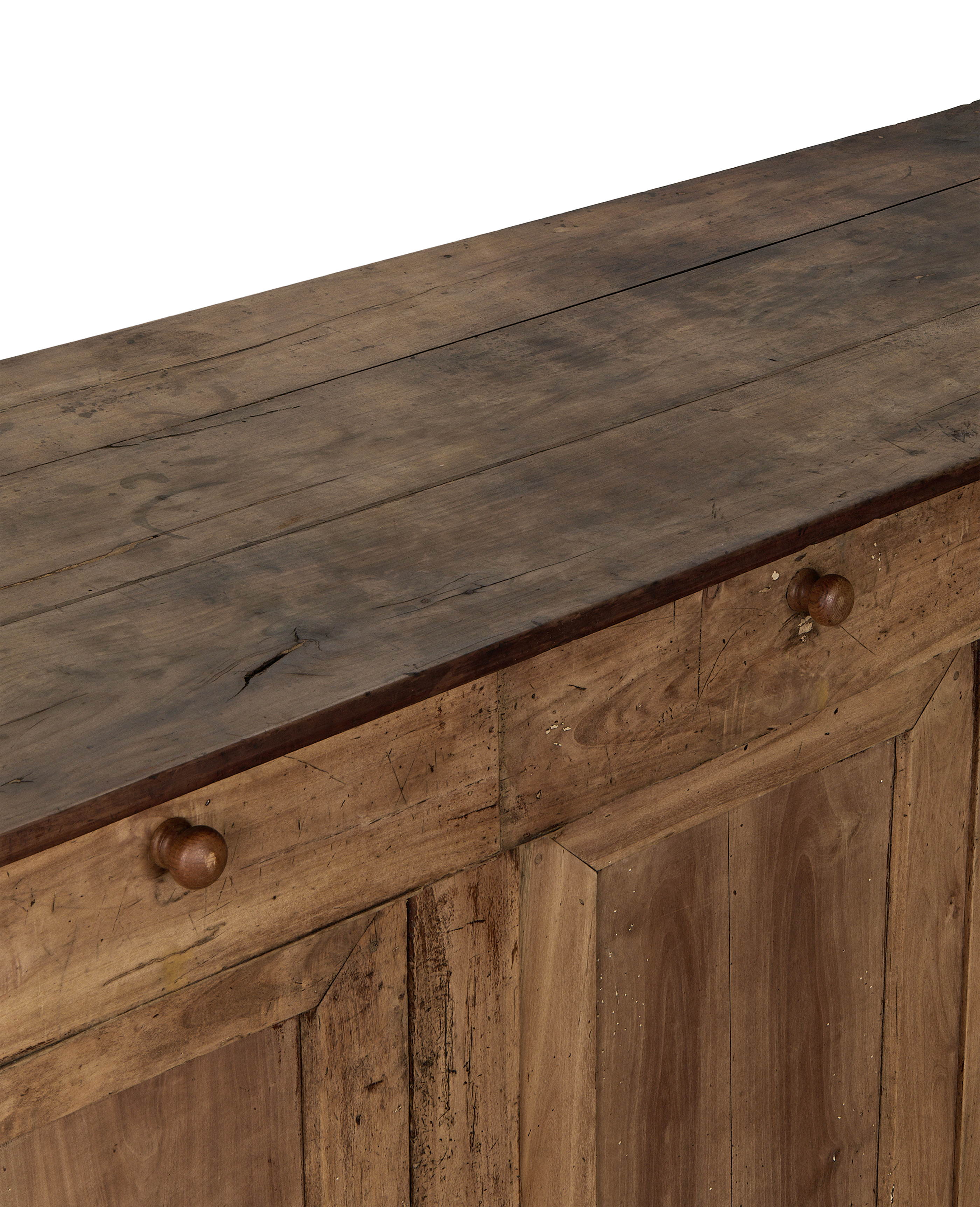 Vintage French oak sideboard top surface and drawer facade with wooden knobs.