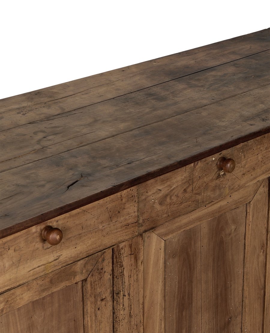 Vintage French oak sideboard top surface and drawer facade with wooden knobs.