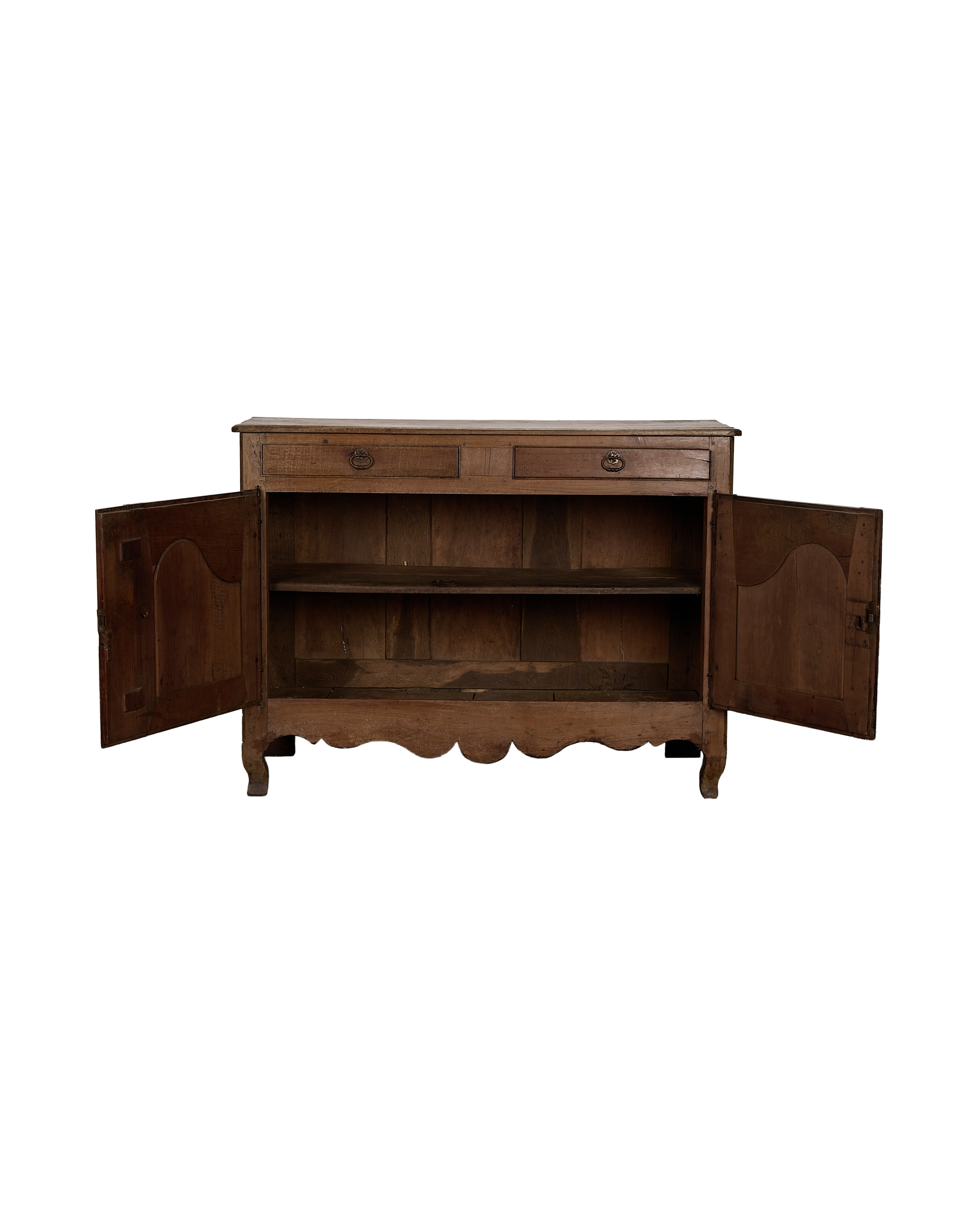 Vintage French oak sideboard's open doors reveal interior shelves and drawers.