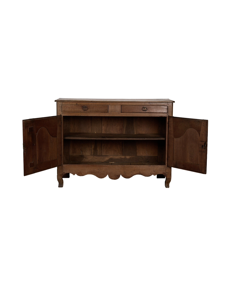 Vintage French oak sideboard's open doors reveal interior shelves and drawers.