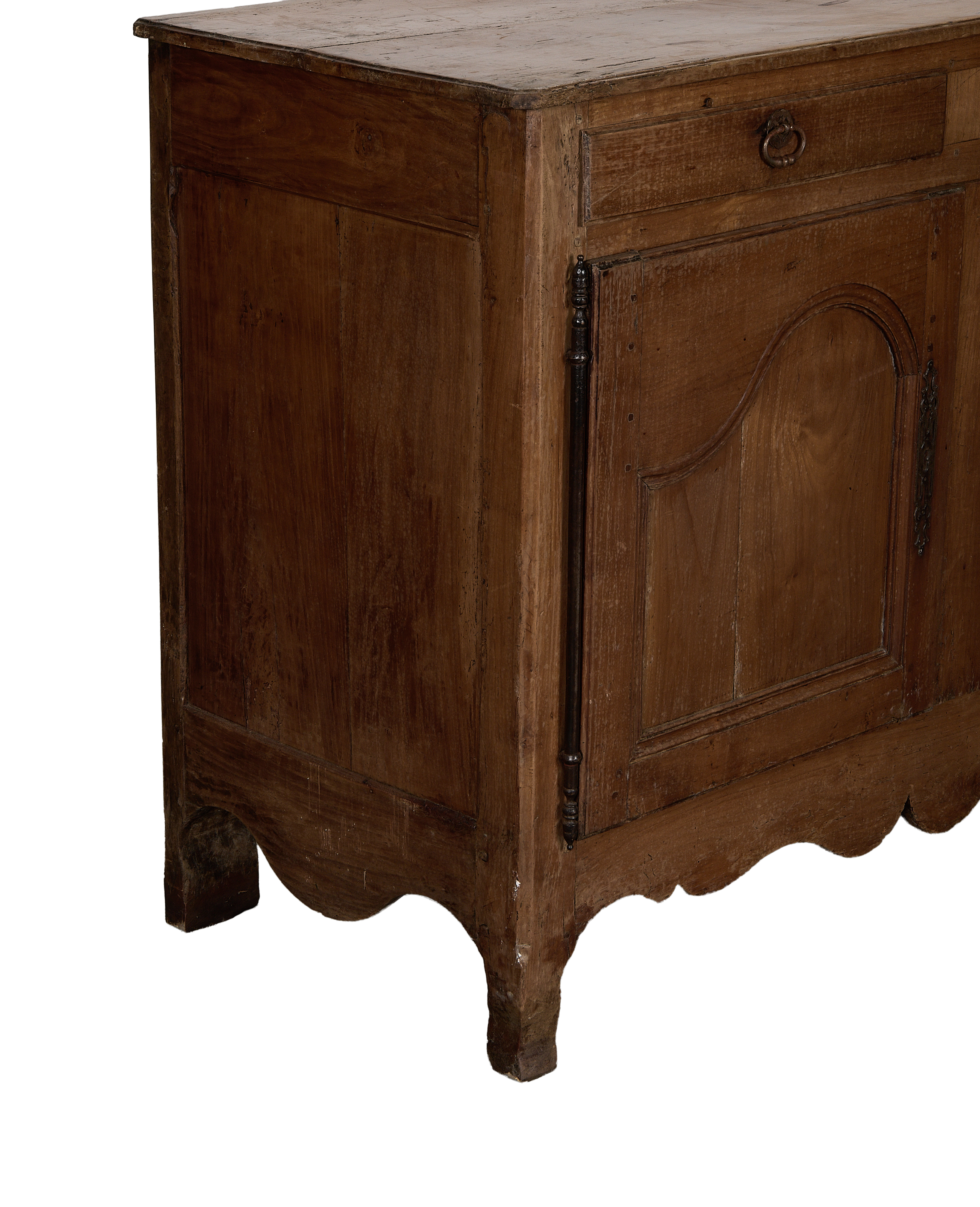 Vintage French oak sideboard, close up of scalloped bottom edge and decorative hardware.