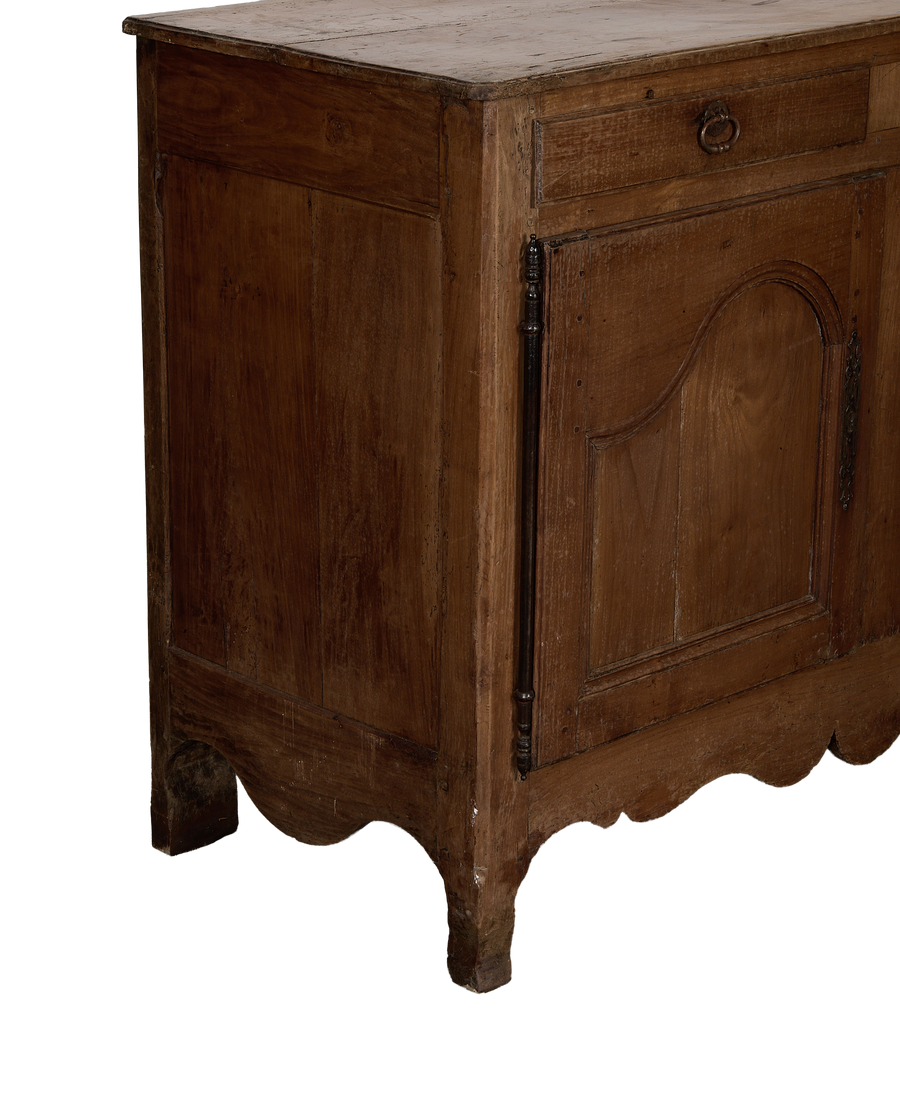 Vintage French oak sideboard, close up of scalloped bottom edge and decorative hardware.
