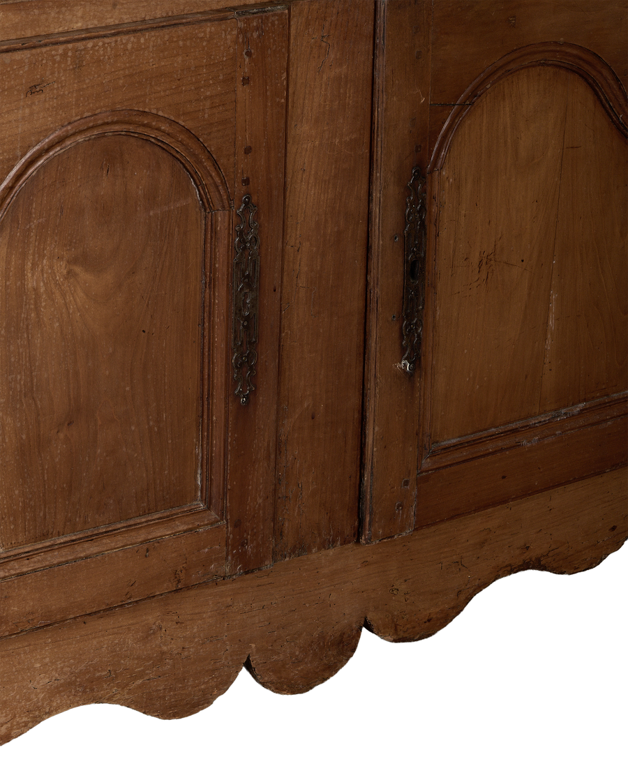 Vintage French oak sideboard, close up of ornate metal hardware and scalloped apron.