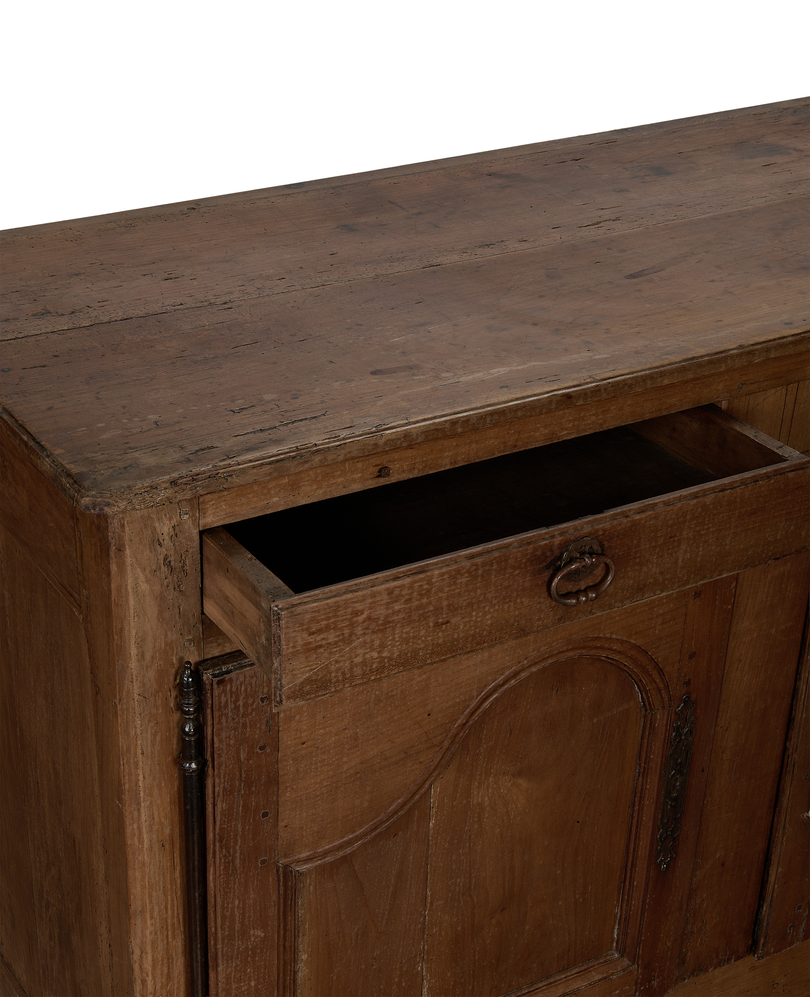 Open drawer of vintage French oak sideboard, showcasing interior and distressed wood texture.