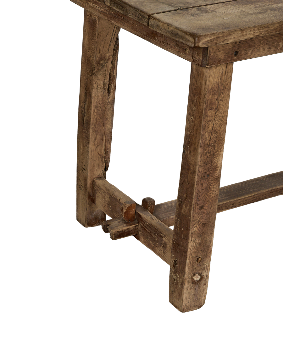 Vintage French oak work table corner, showing authentic mortise-and-tenon construction.