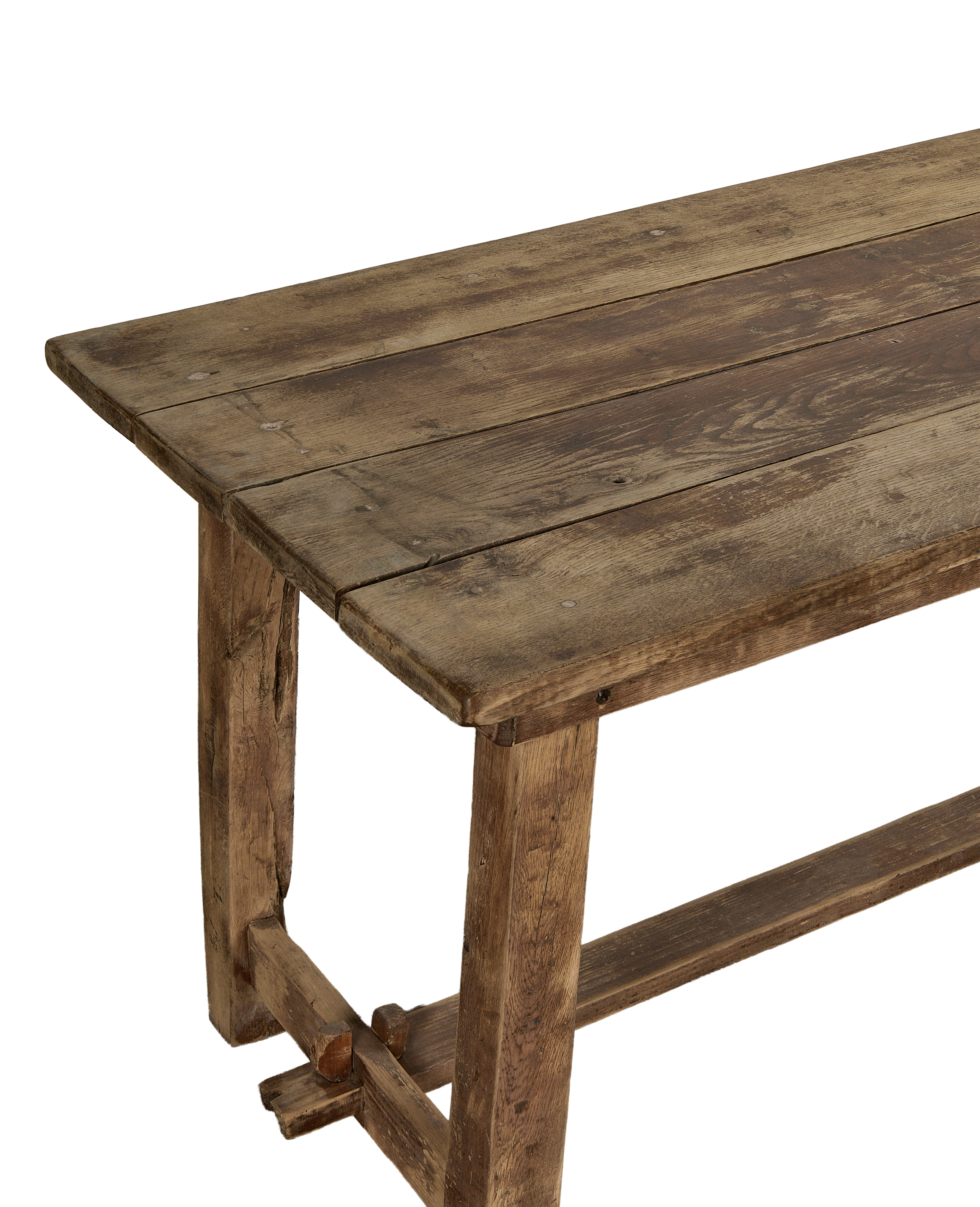 Vintage French oak country work table, close-up of distressed rustic wood tabletop and base.