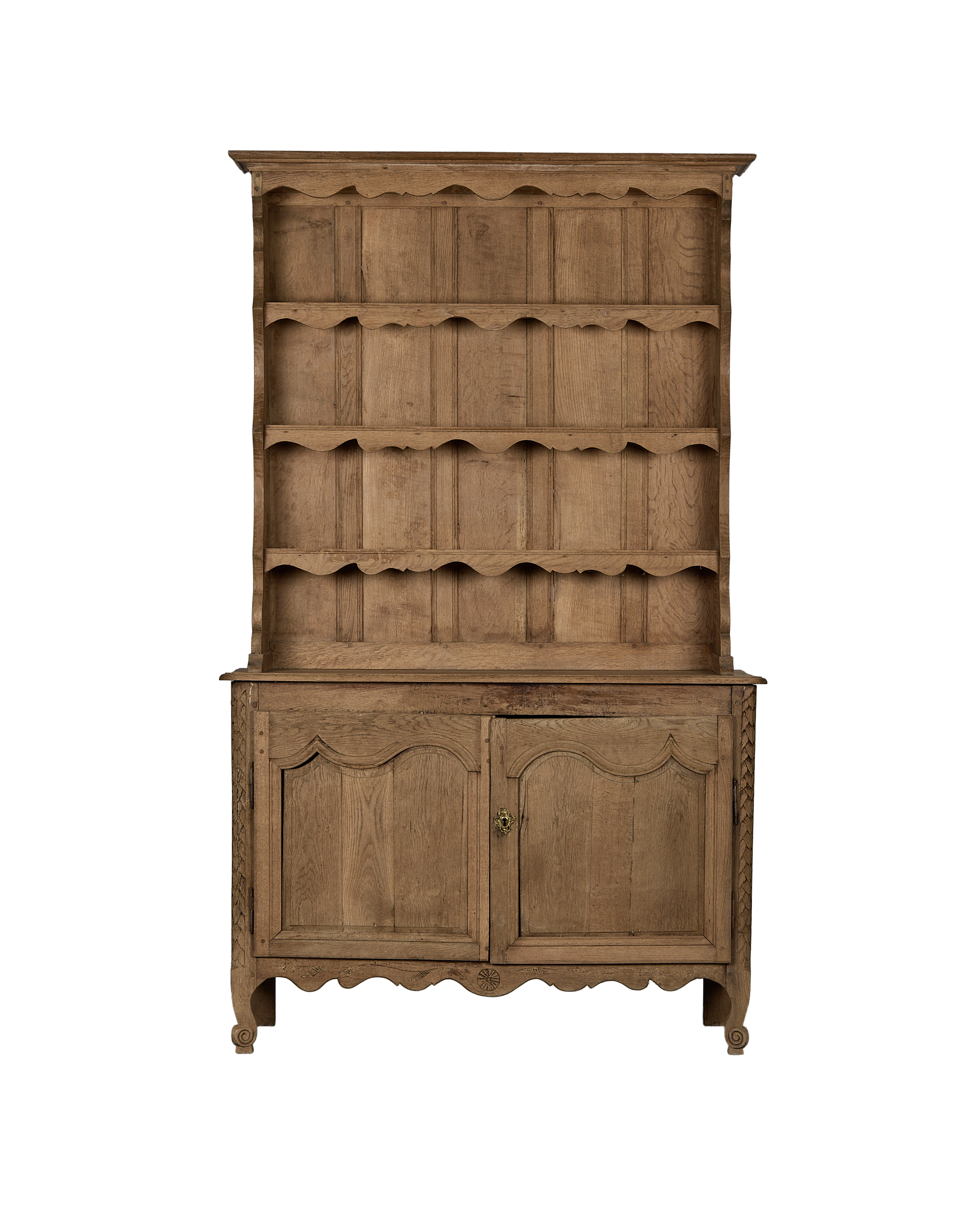 Vintage French oak china cabinet with scalloped shelves and carved details, full view.