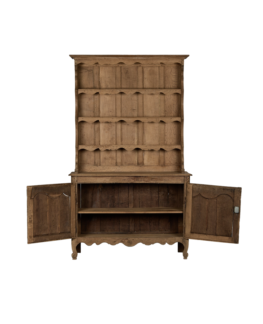 Vintage French oak china cabinet with open doors and shelves, showcasing interior storage.