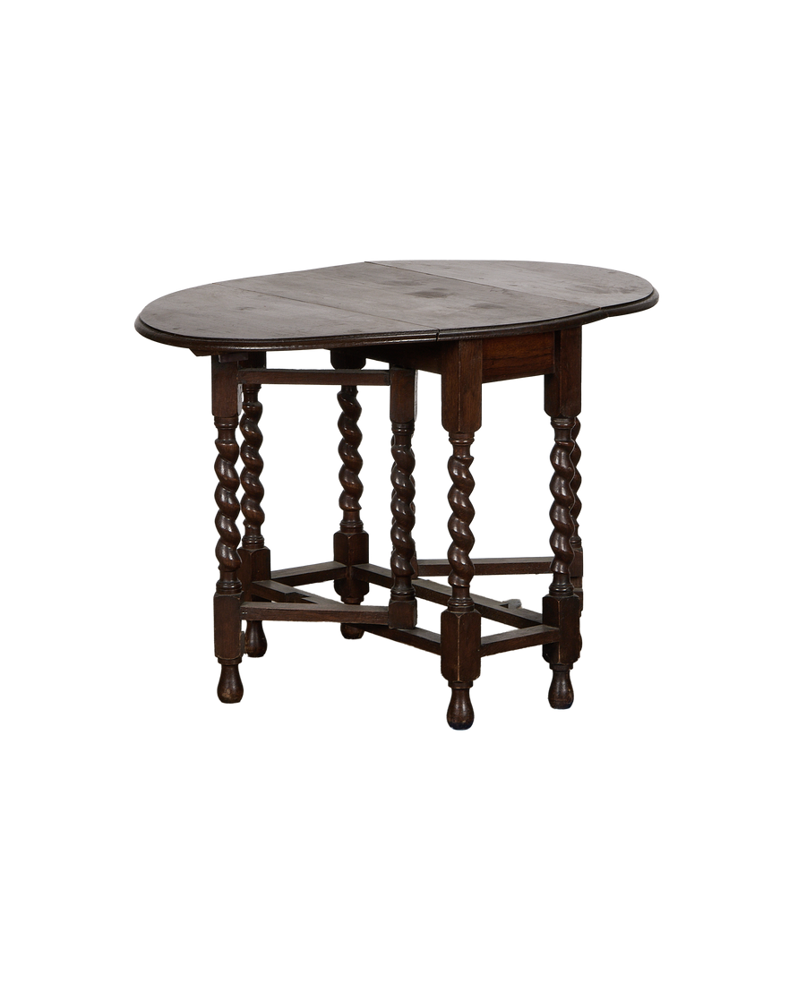 Vintage French oak Barley Twist drop leaf table with raised leaf and visible grain.