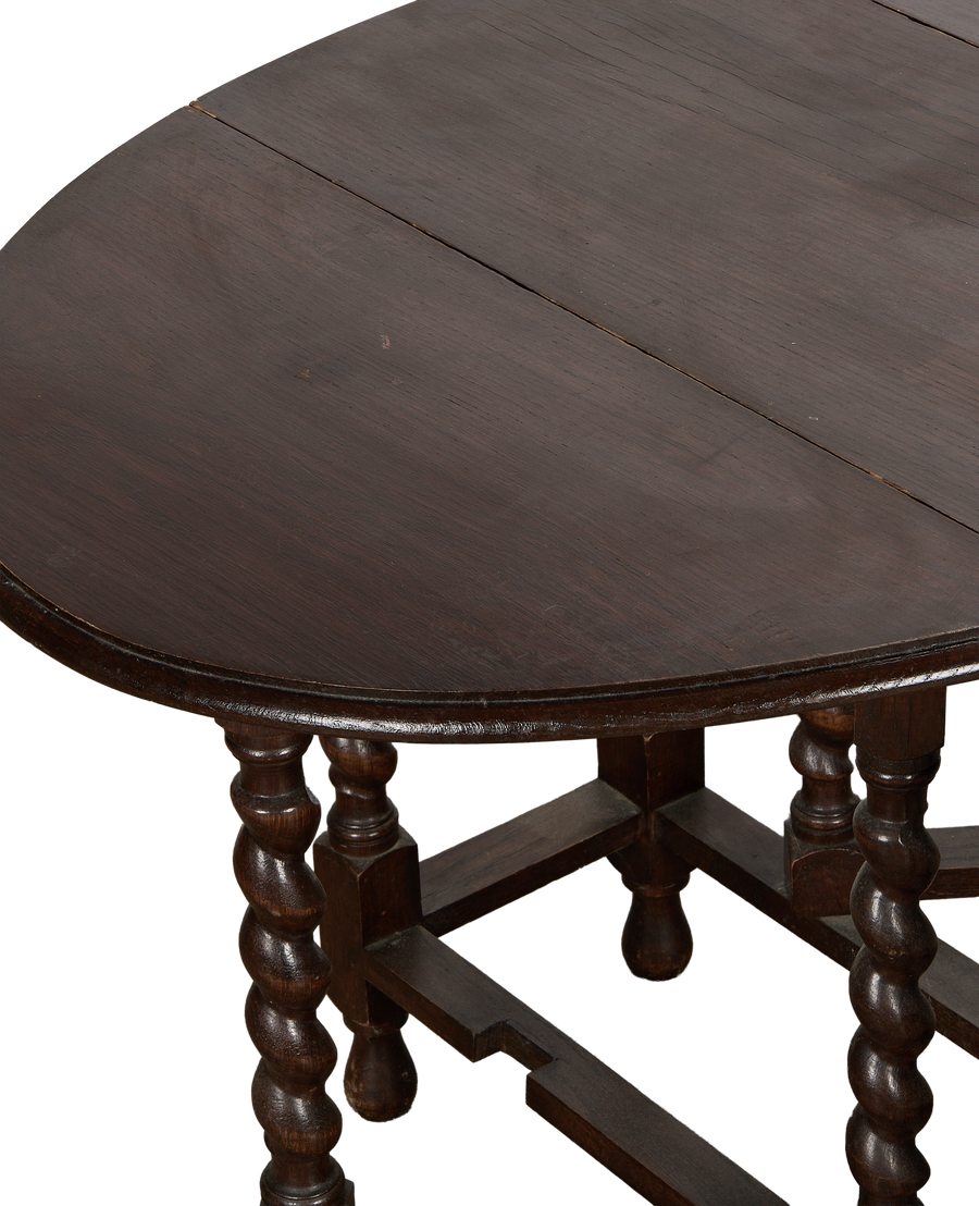 Vintage French oak drop leaf table, barley twist legs, dark wood grain top from above.