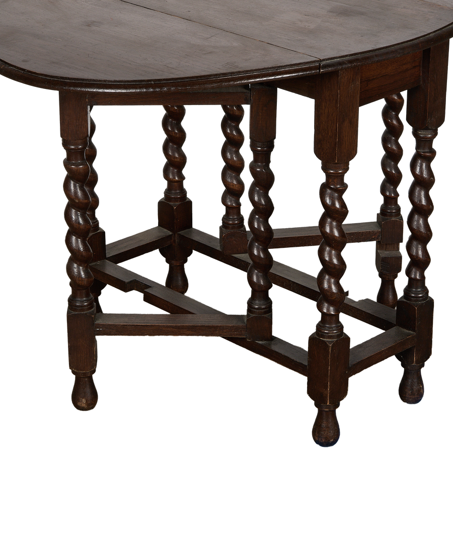 Vintage French oak drop-leaf table, showing details of barley twist legs and stretcher base.
