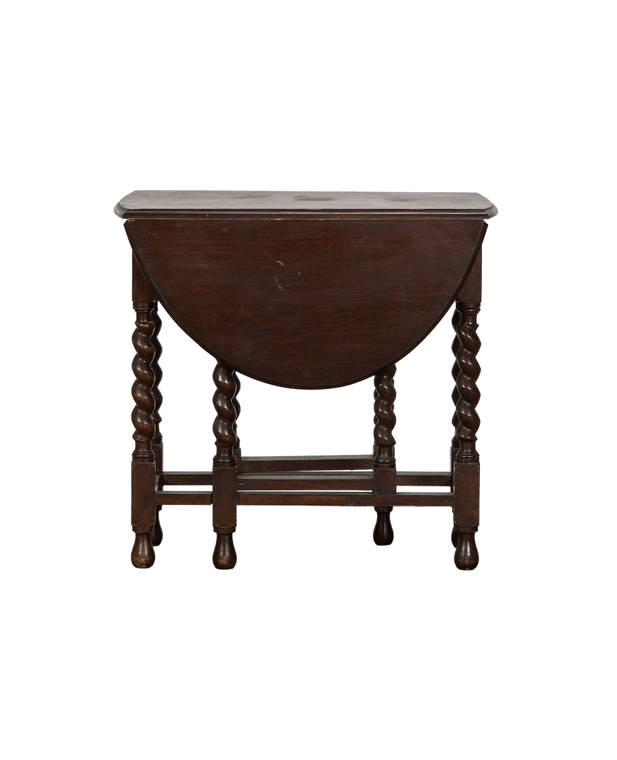 Vintage French oak barley twist drop leaf table, leaves folded, showing intricate turned legs.