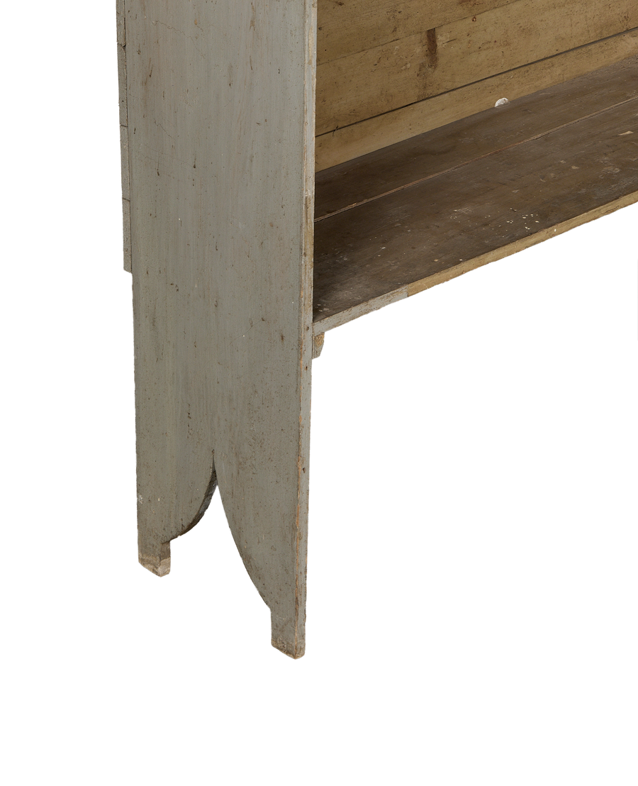 Vintage French oak scalloped shelving detail, showing gray painted wood and natural texture.