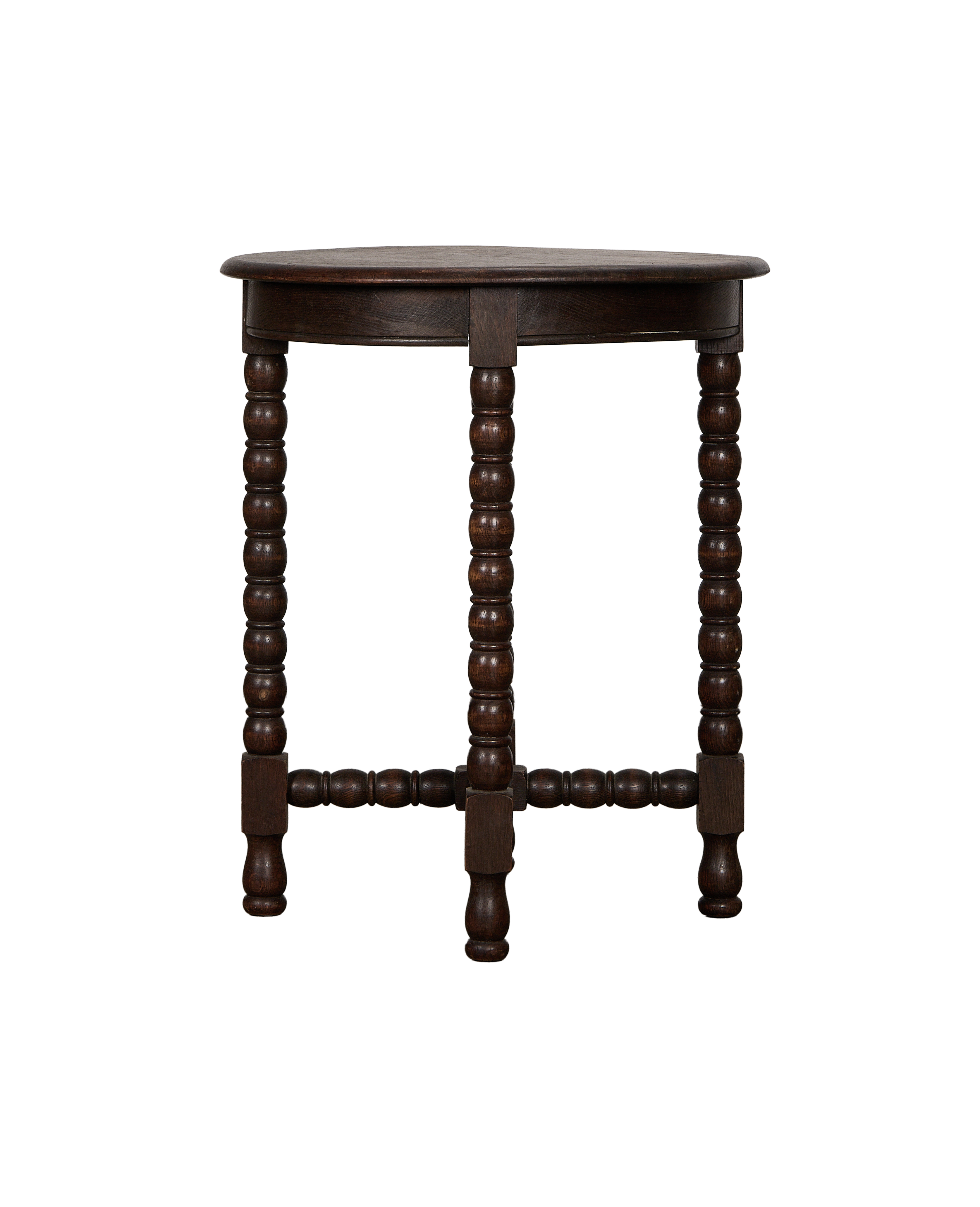 Vintage French bobbin-leg oak side table, full front view displaying dark wood finish.