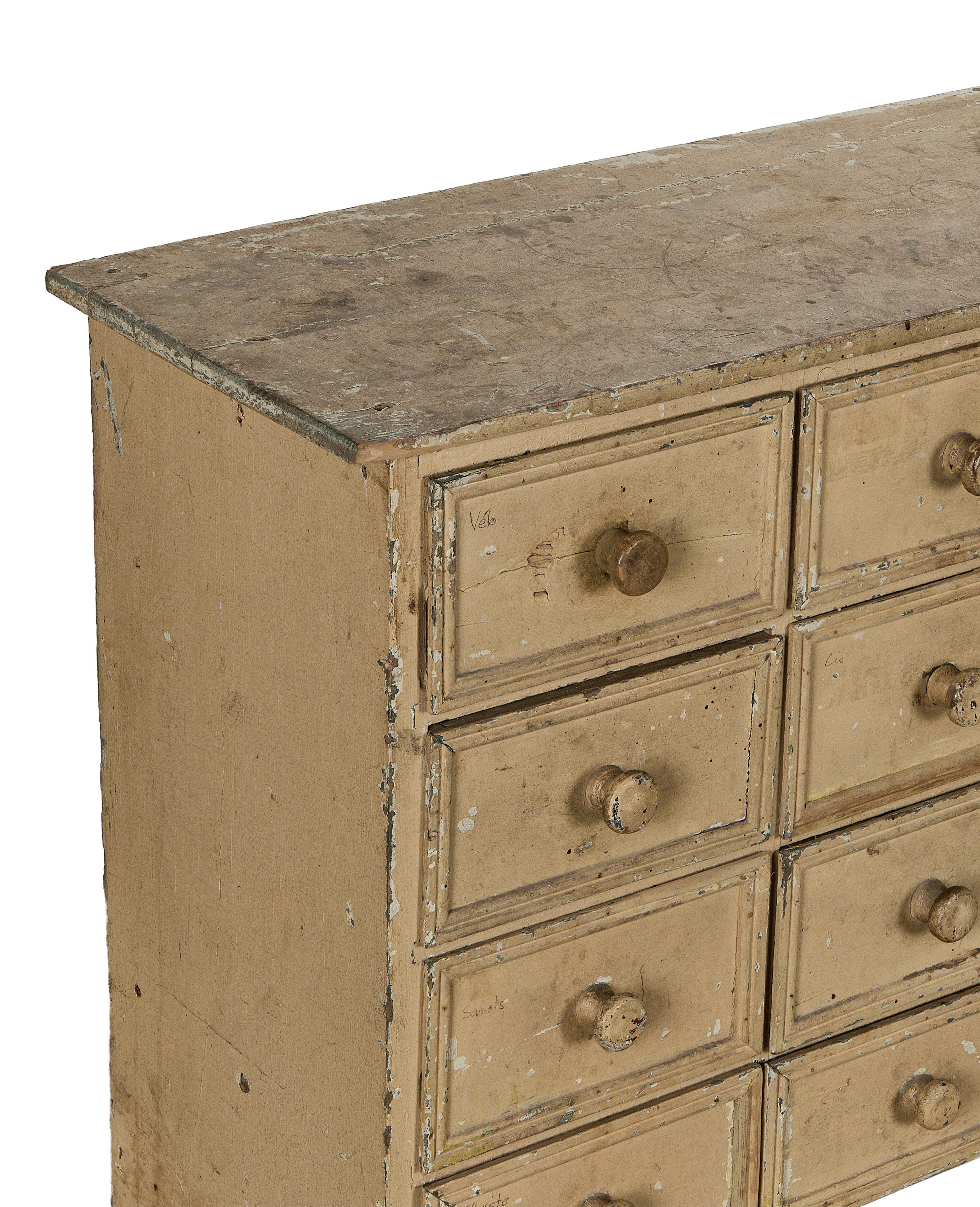 Distressed painted oak vintage French apothecary console details, showing texture and multiple drawers.