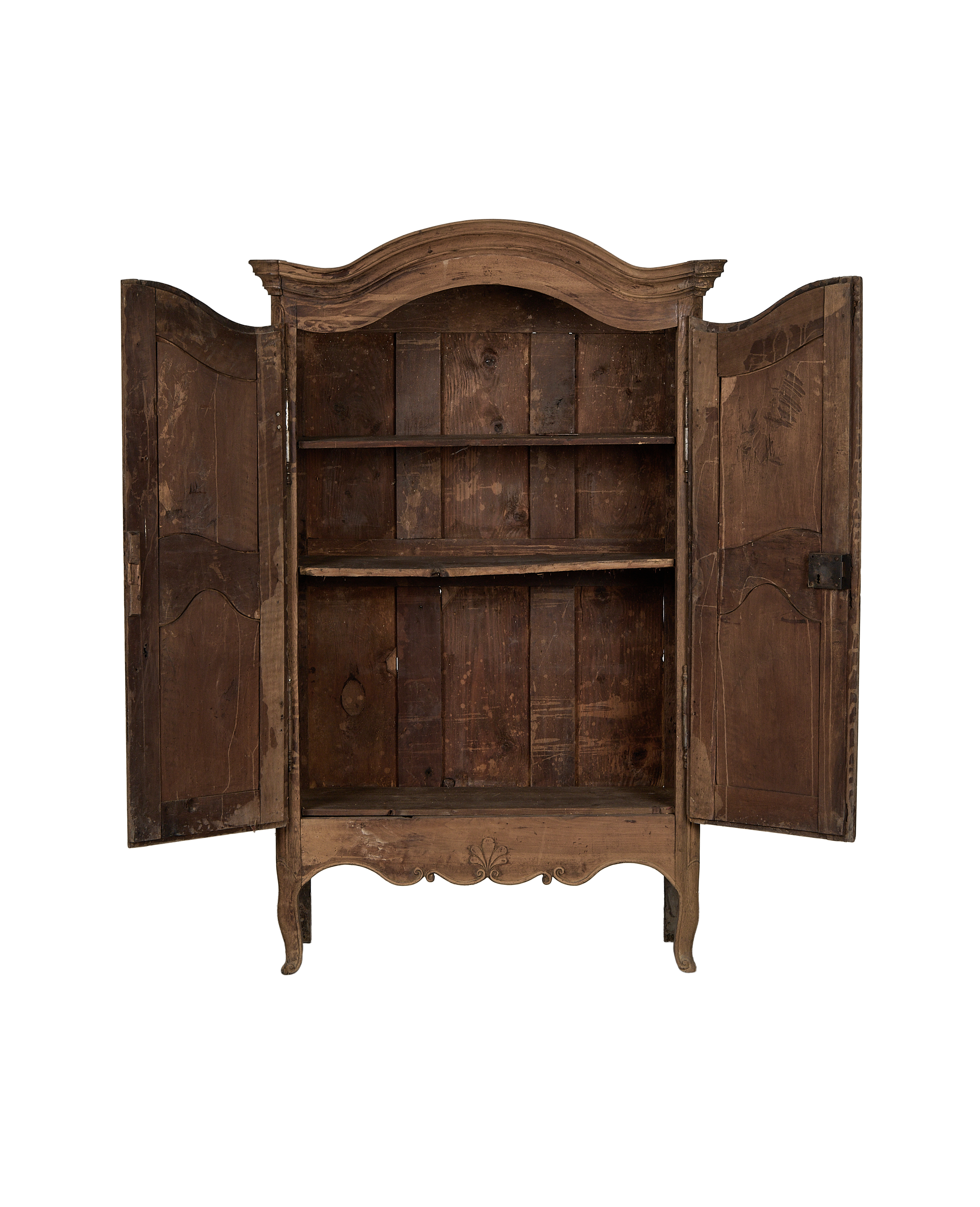 Distressed 18th Century French oak armoire, doors open, revealing raw vintage interior shelves.