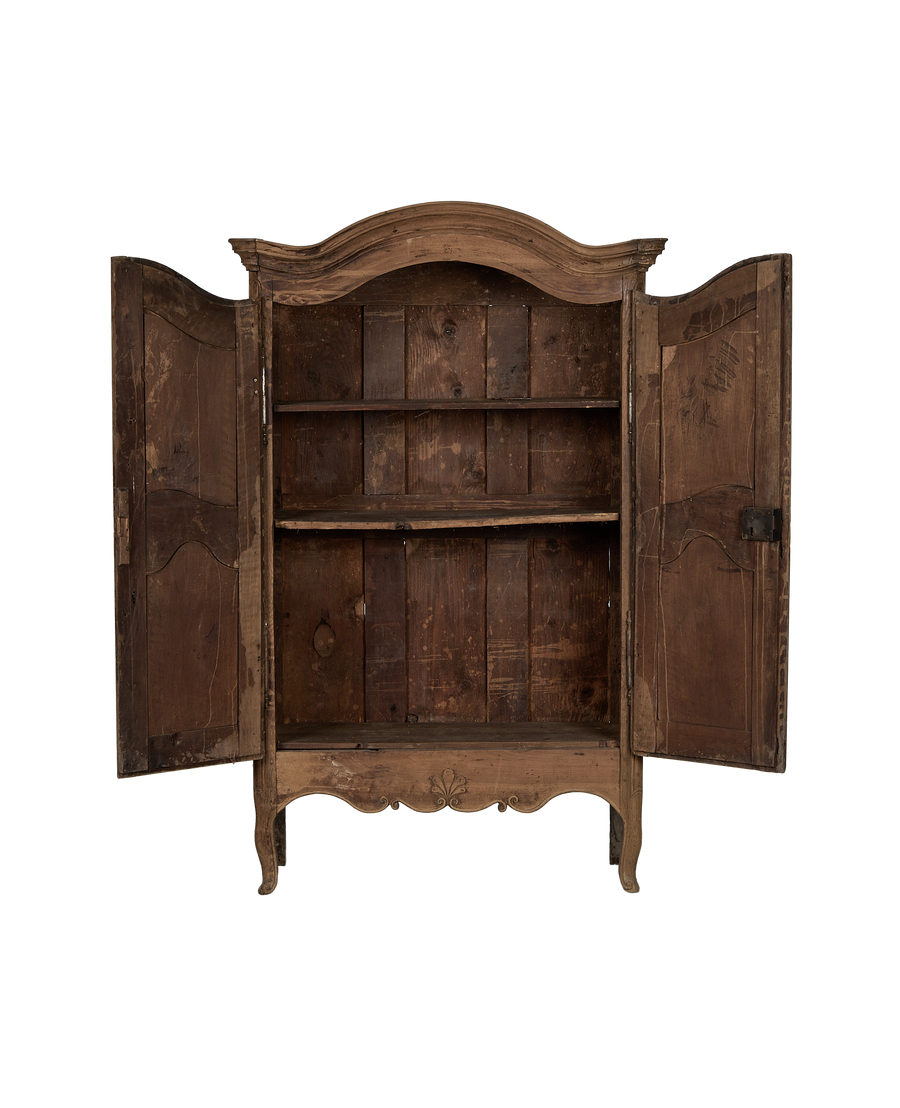 Distressed 18th Century French oak armoire, doors open, revealing raw vintage interior shelves.