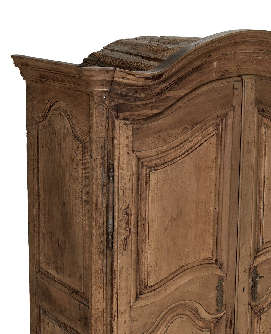 French 18th Century vintage oak armoire, showing distressed wood, curved top detail.