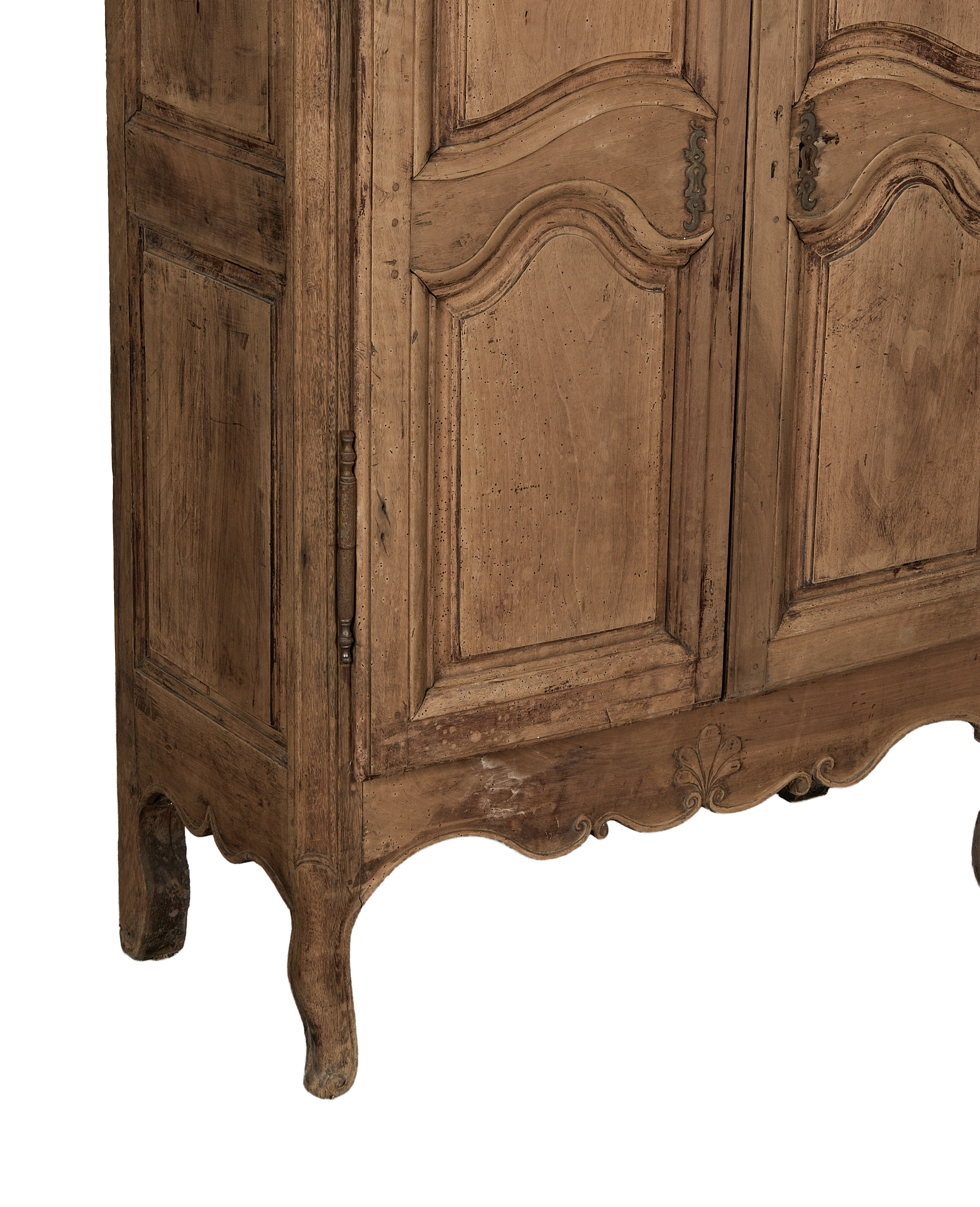 Vintage 18th-century French oak armoire, lower right detail emphasizing cabriole legs and Rococo carving.