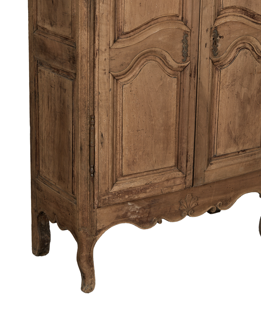 Vintage 18th-century French oak armoire, lower right detail emphasizing cabriole legs and Rococo carving.