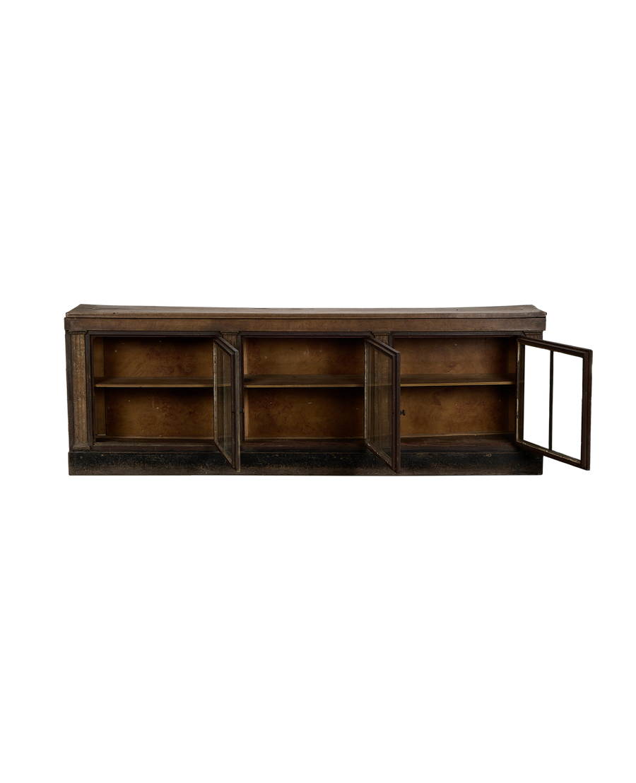 Vintage French oak sideboard, glass doors open, revealing interior shelves and aged wood.