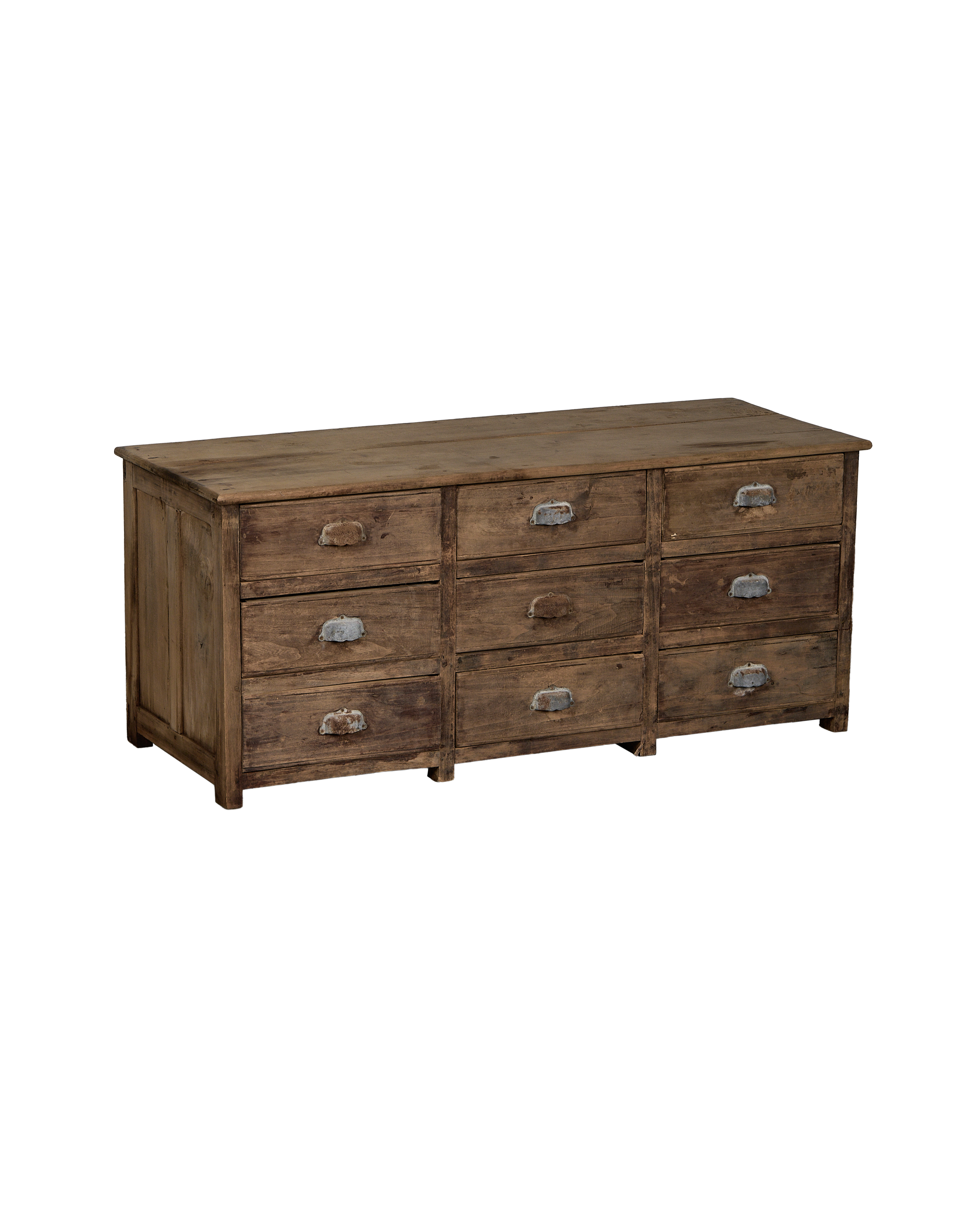 Vintage French oak sideboard displaying nine drawers with worn metal pulls, showing natural distressing.