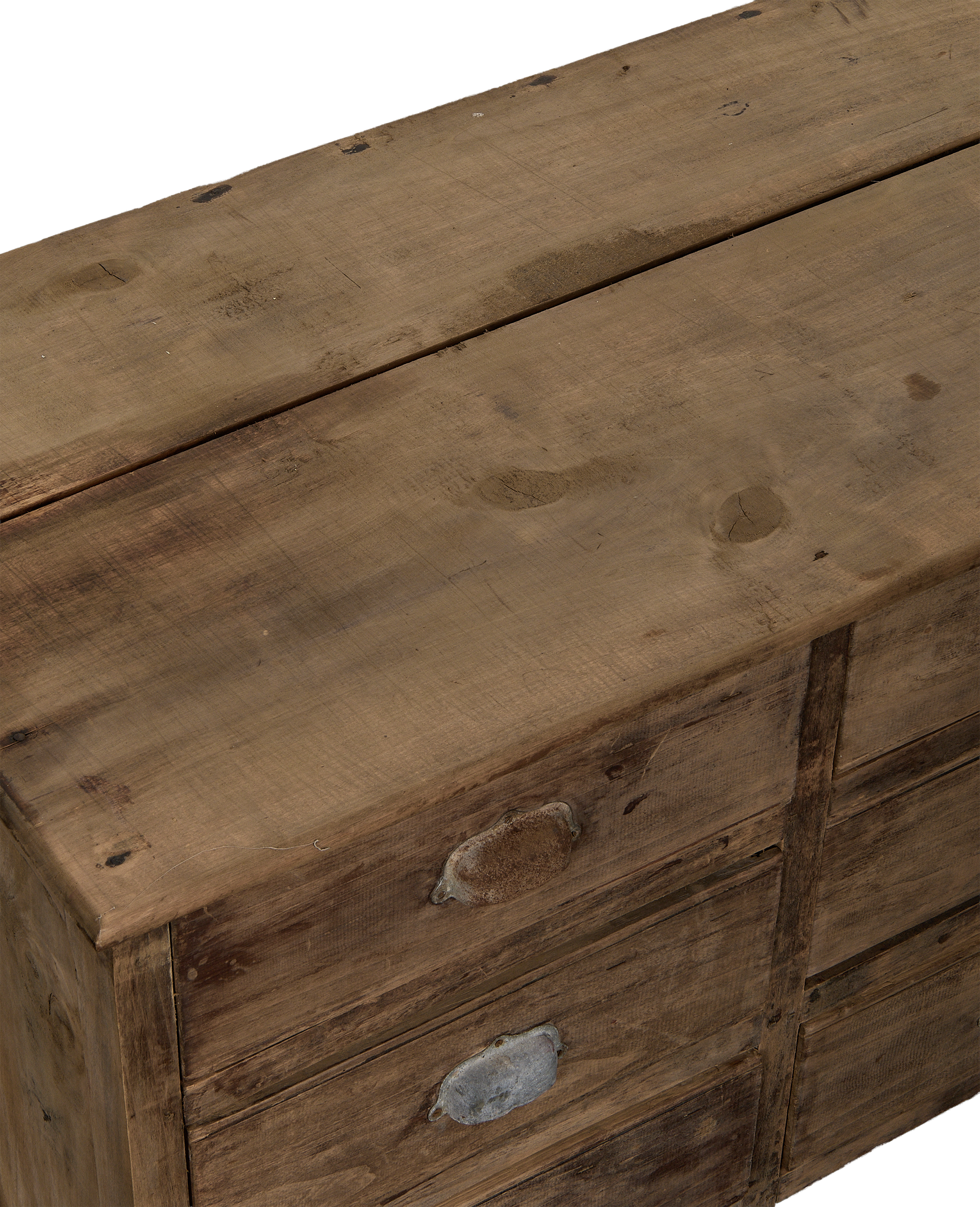 Vintage French oak sideboard top and drawer detail, showing worn wood grain and distressed metal pulls.