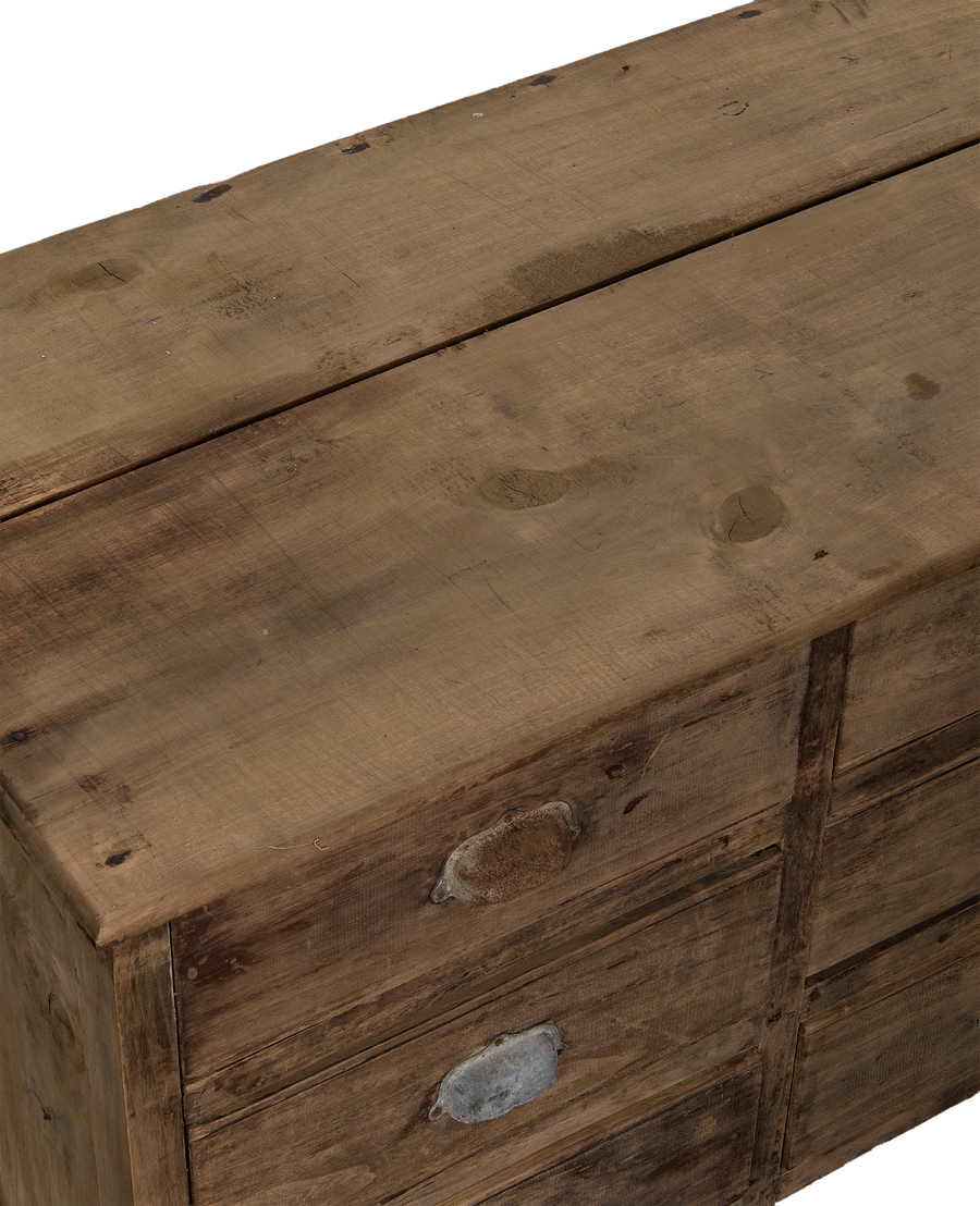 Vintage French oak sideboard top and drawer detail, showing worn wood grain and distressed metal pulls.