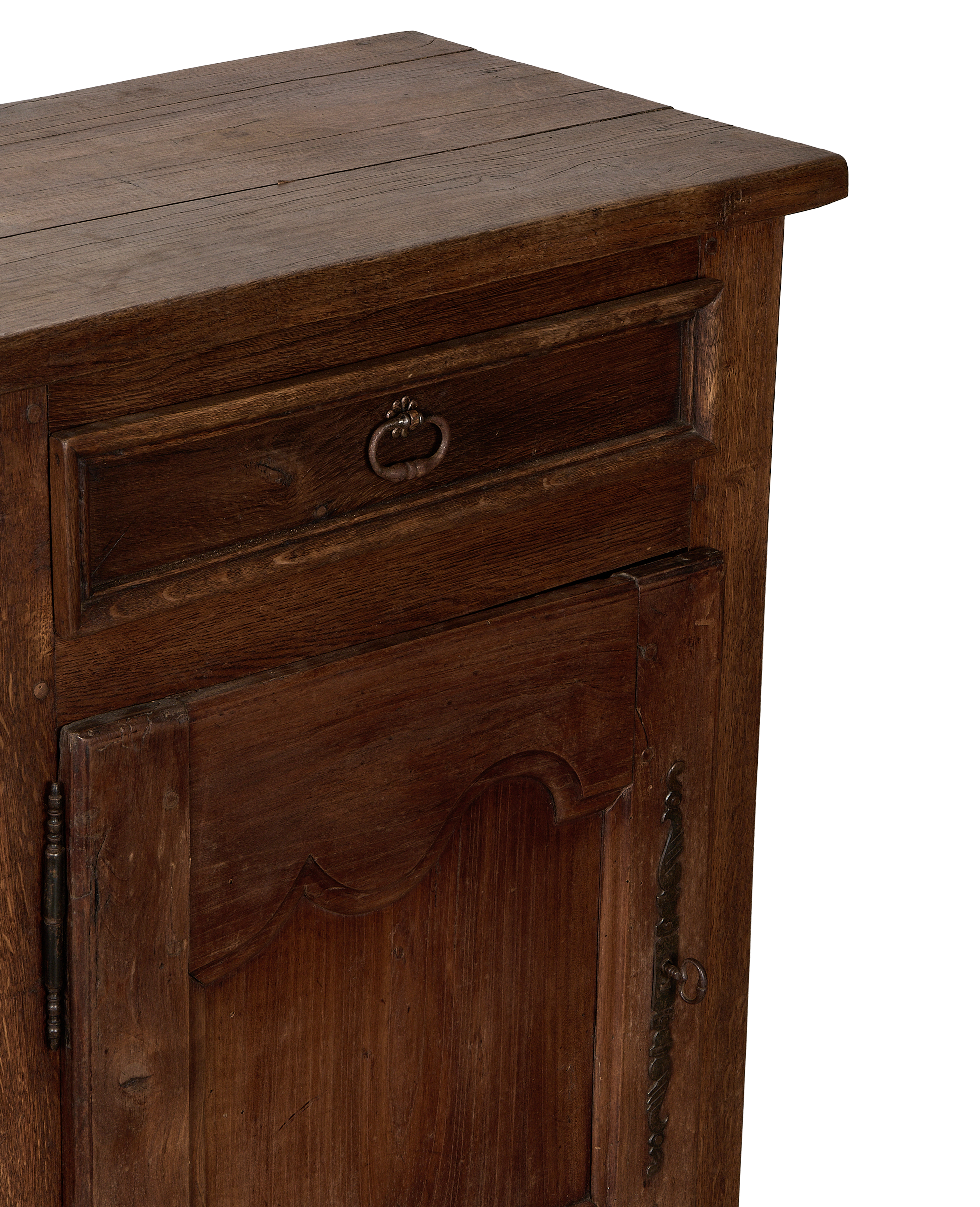 Vintage French oak cabinet detail, showcasing antique metal hardware, rustic wood grain, and aged patina.