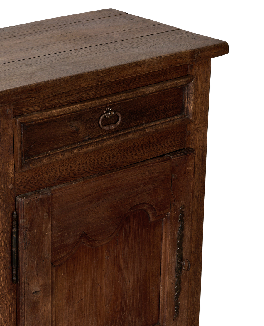 Vintage French oak cabinet detail, showcasing antique metal hardware, rustic wood grain, and aged patina.