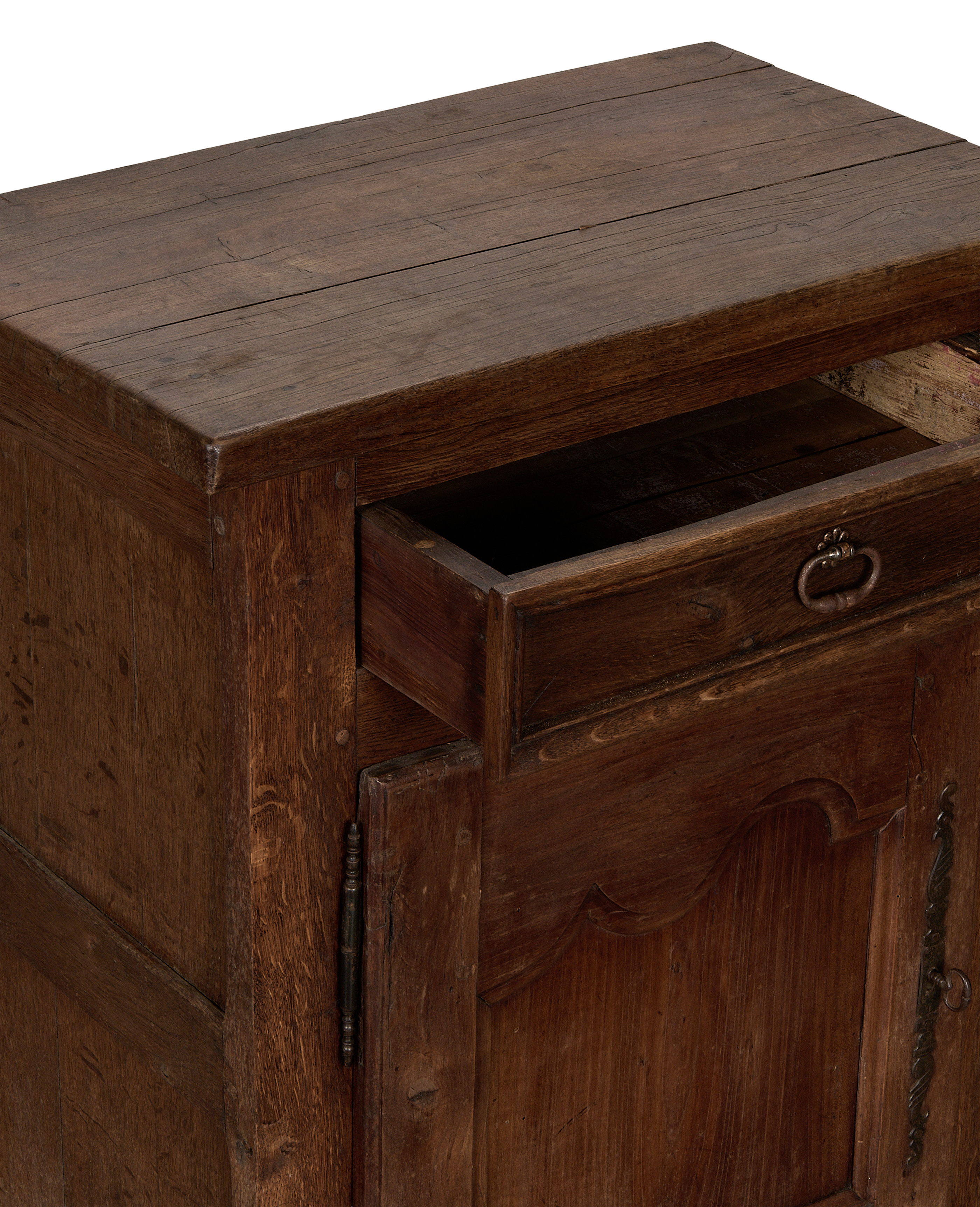 Vintage French oak cabinet with extended open drawer showing interior and ornate hardware.
