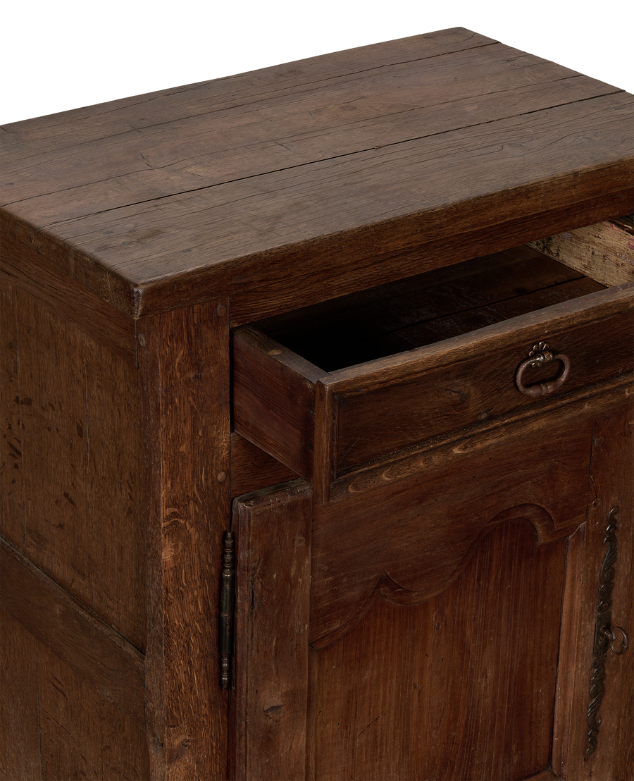 Vintage French oak cabinet with extended open drawer showing interior and ornate hardware.