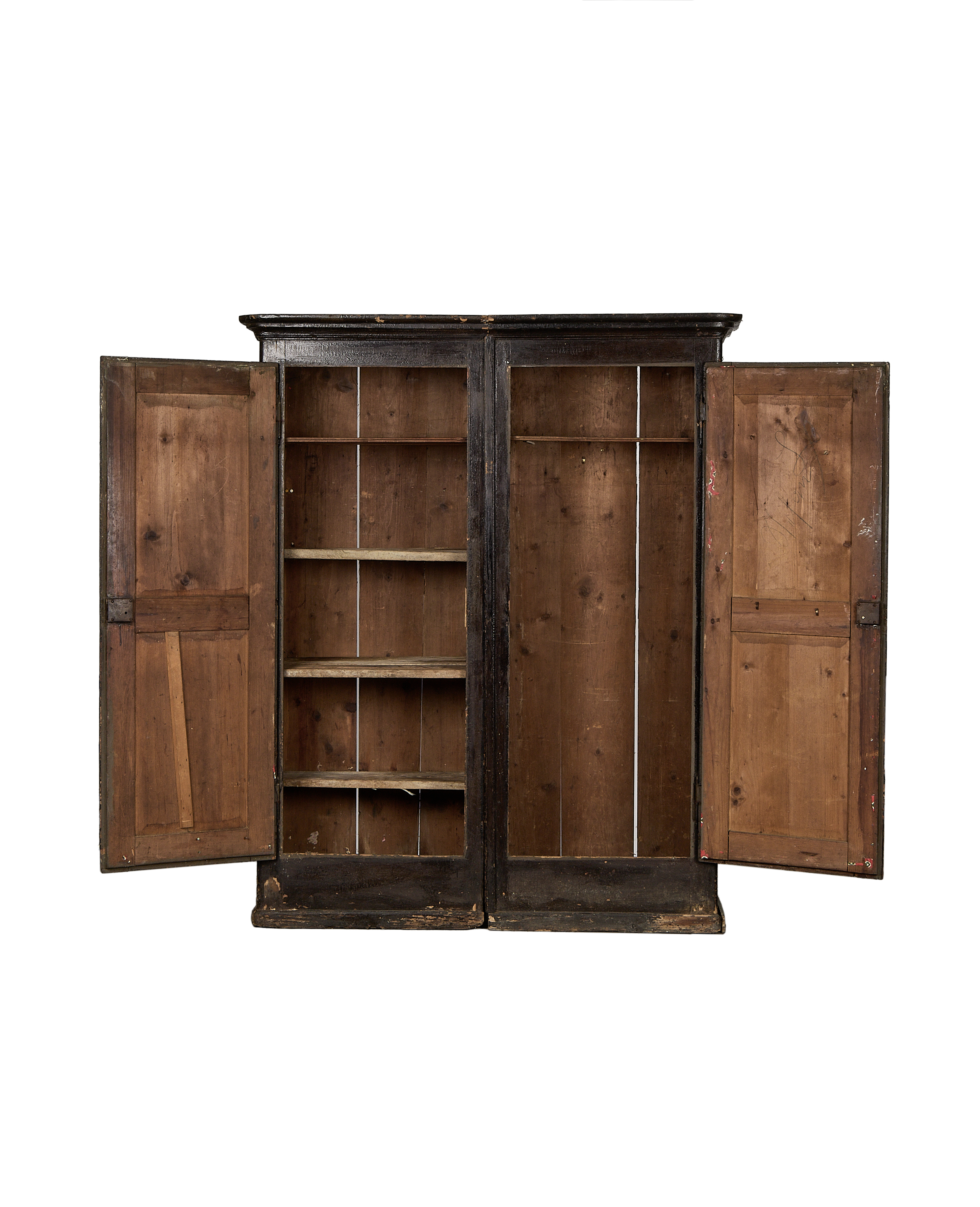 Vintage Parisian oak armoire, doors open revealing rustic interior shelves and distressed finish details.