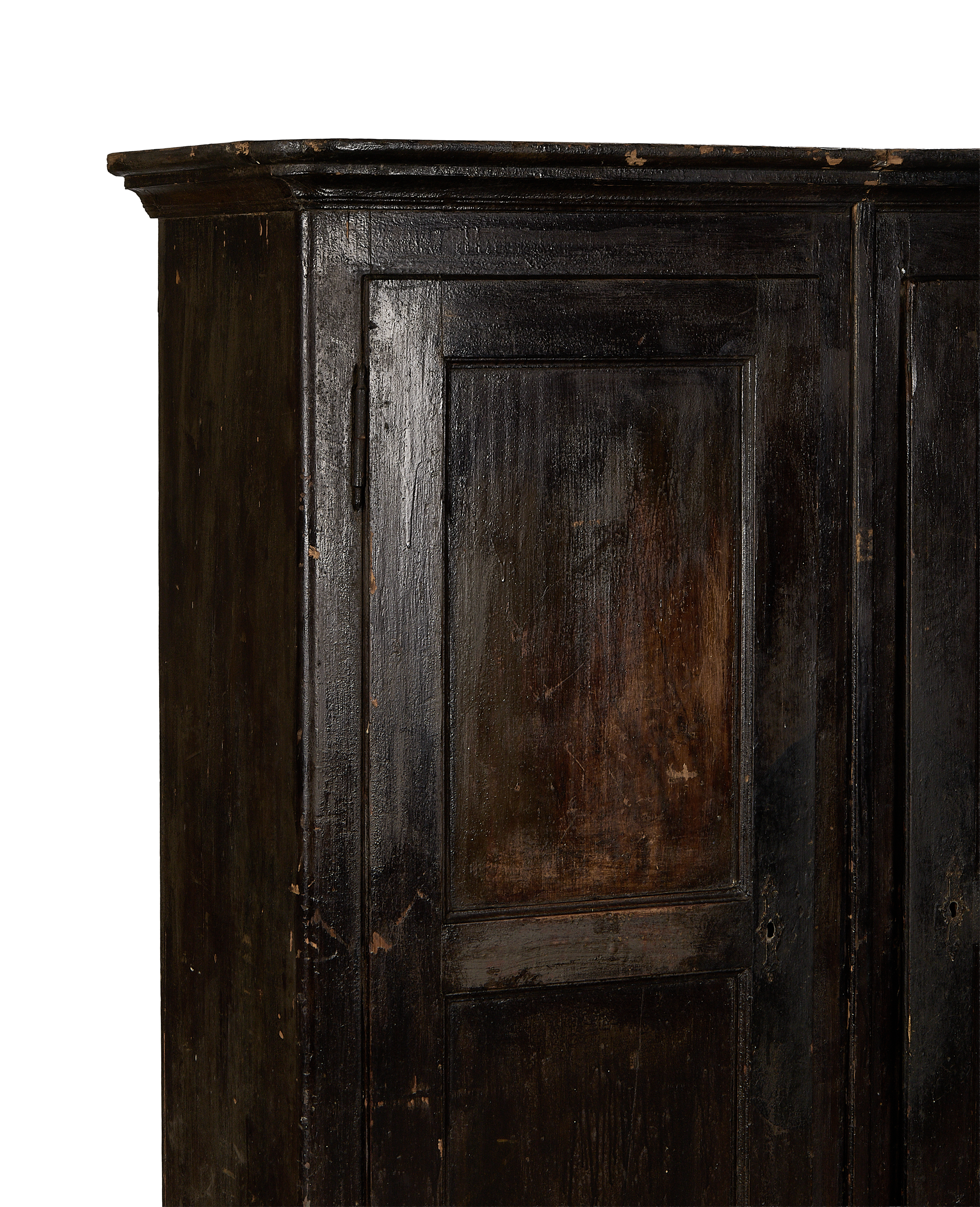 Vintage Parisian oak armoire, close-up of dark distressed wood and aged paneling, France.