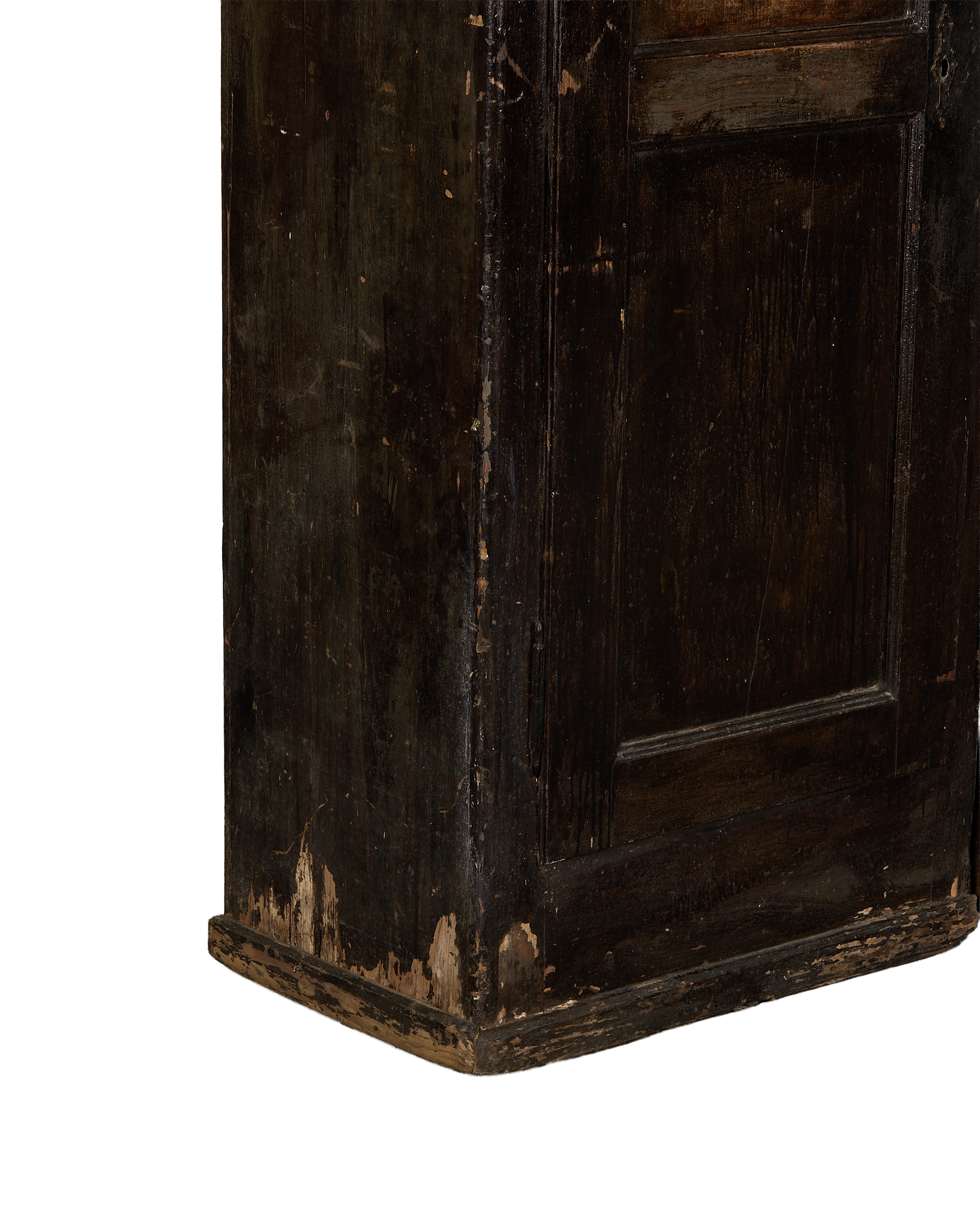 Close-up of vintage Parisian oak armoire's chipped, distressed dark paint finish.