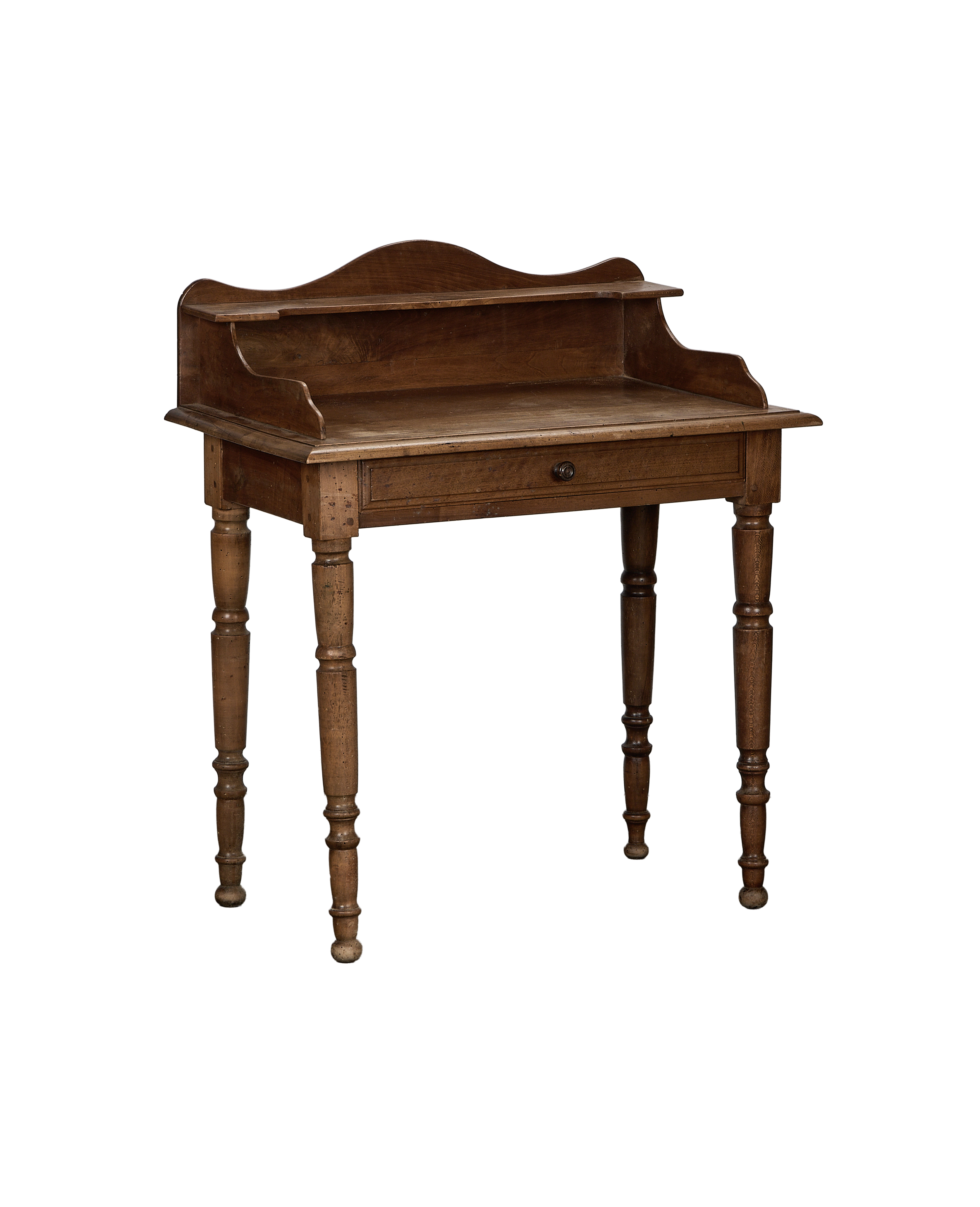Vintage French oak desk, front angle, showing drawer and turned legs.