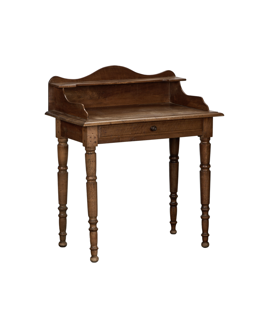 Vintage French oak desk, front angle, showing drawer and turned legs.