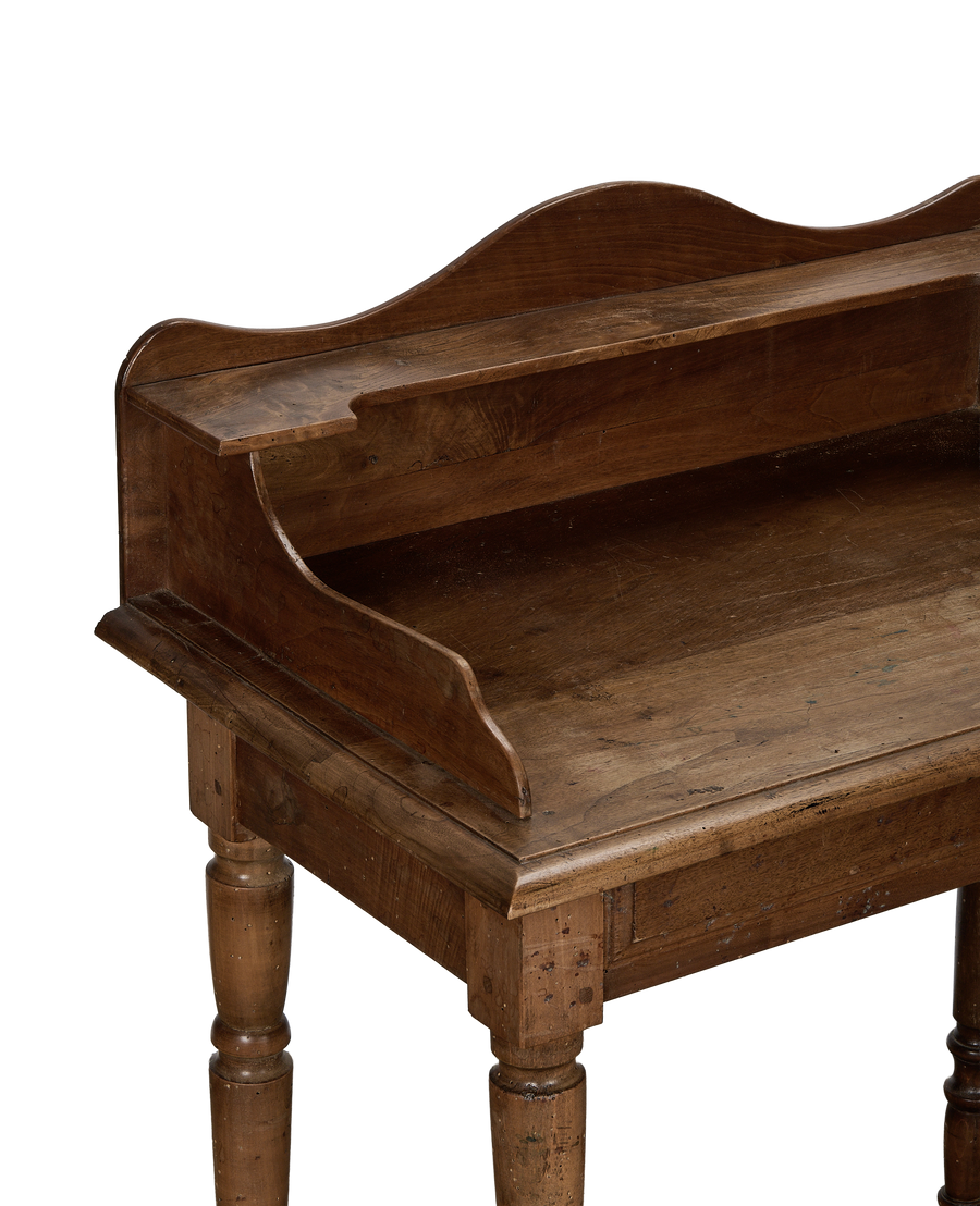 Vintage French oak desk, detail view of the curved front hutch and turned legs.