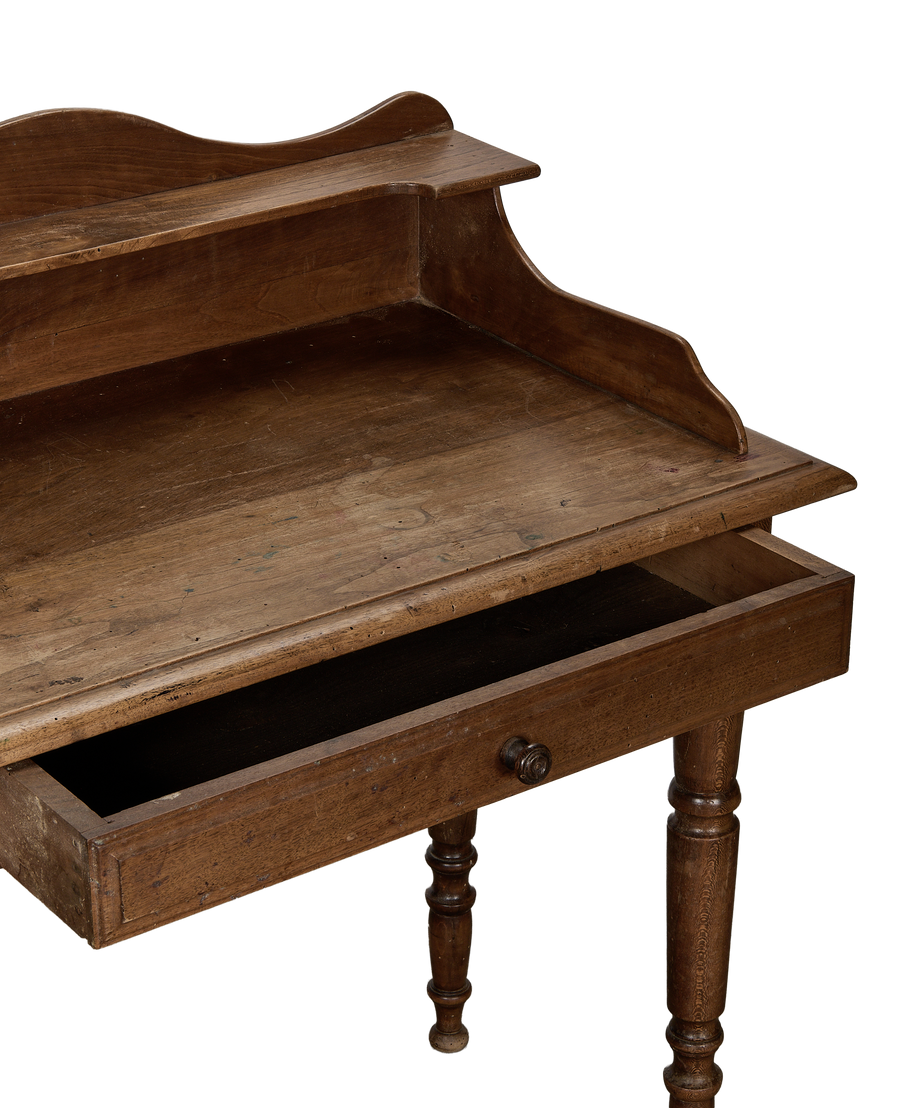 Vintage French oak desk, open drawer revealing interior, turned leg detail.