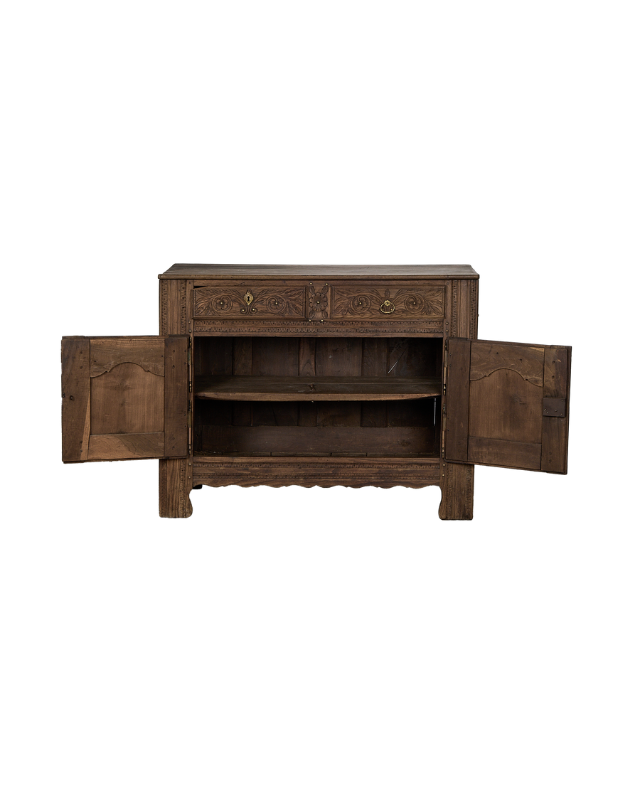 Vintage French carved oak sideboard with open doors revealing interior shelves.