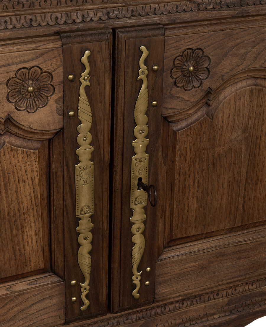 Vintage French oak sideboard, close up of ornate brass hardware and carving with key.