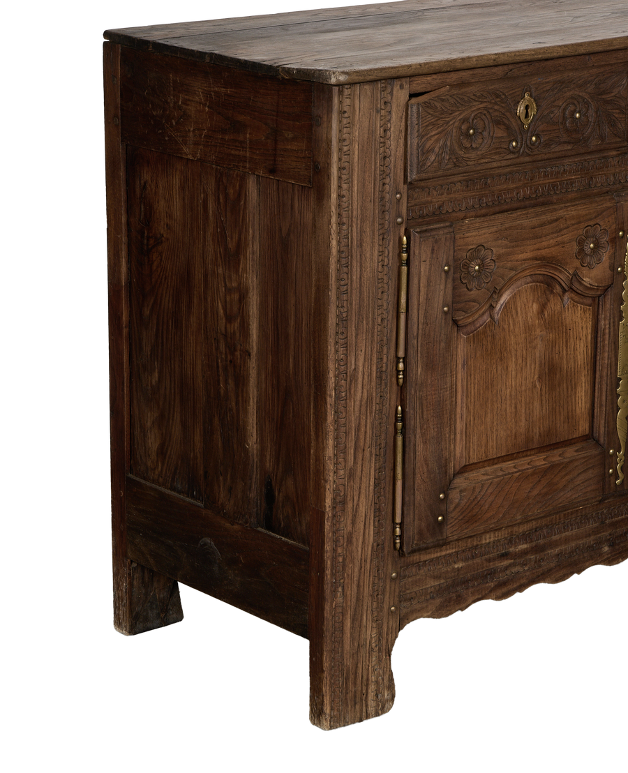 Vintage French oak sideboard, showing intricate carved floral and leaf details on drawer.
