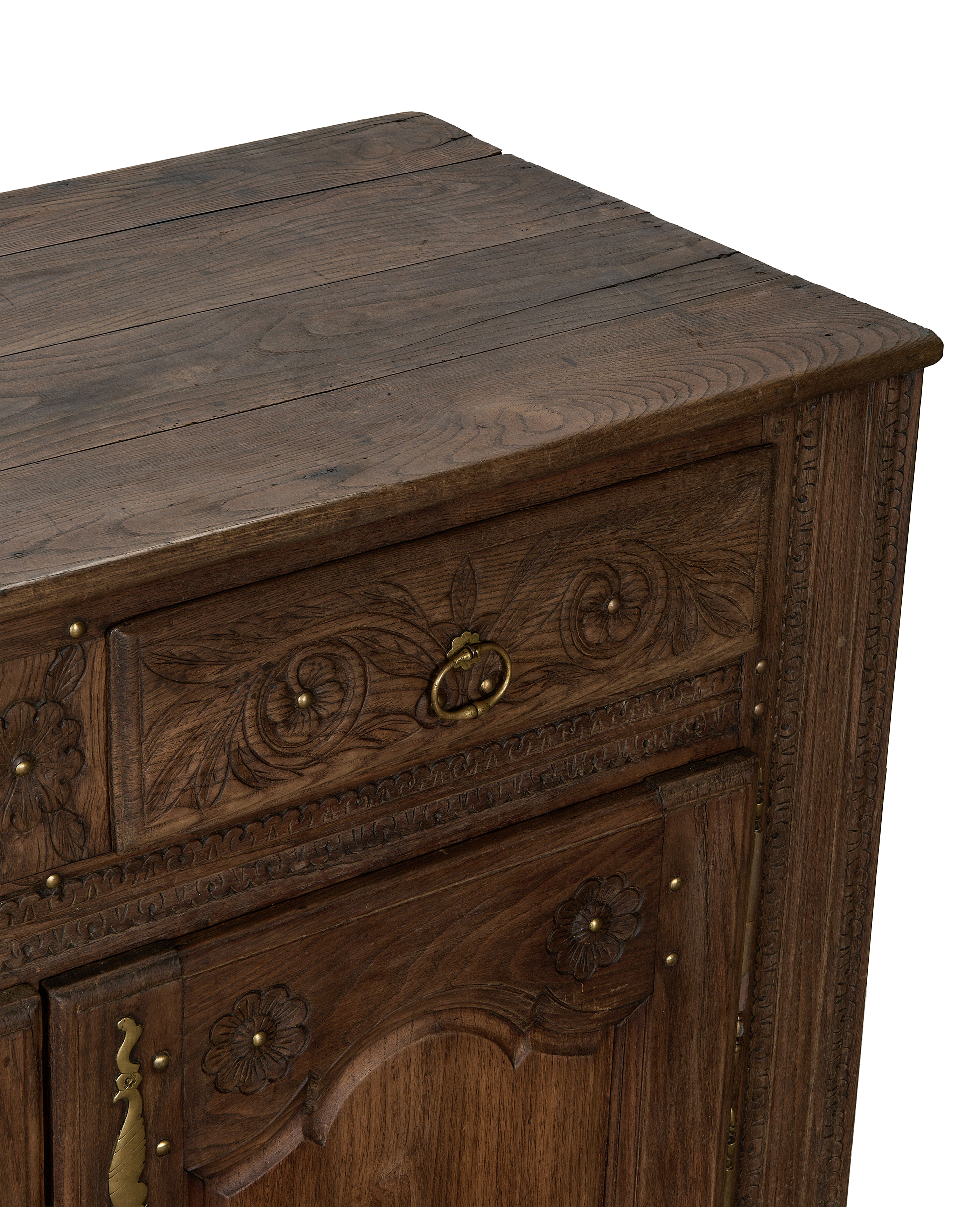 Vintage French oak sideboard, close up of carved floral details and rustic wooden top.