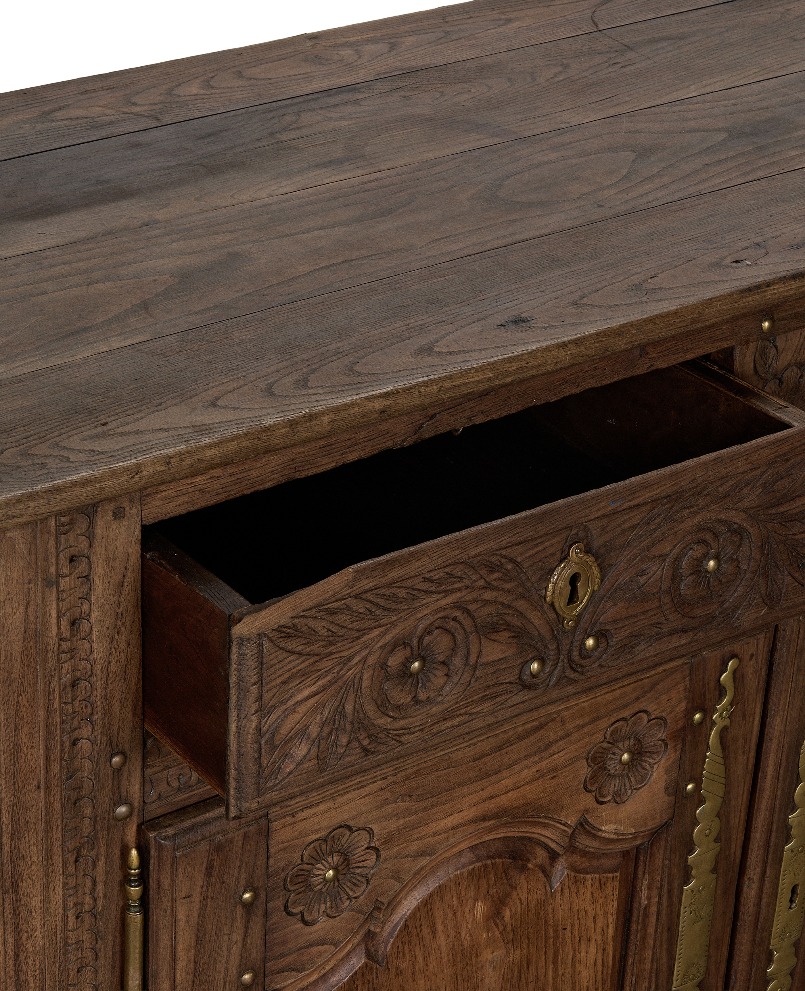 Vintage French oak sideboard, detail of open drawer revealing ornate brass keyhole.